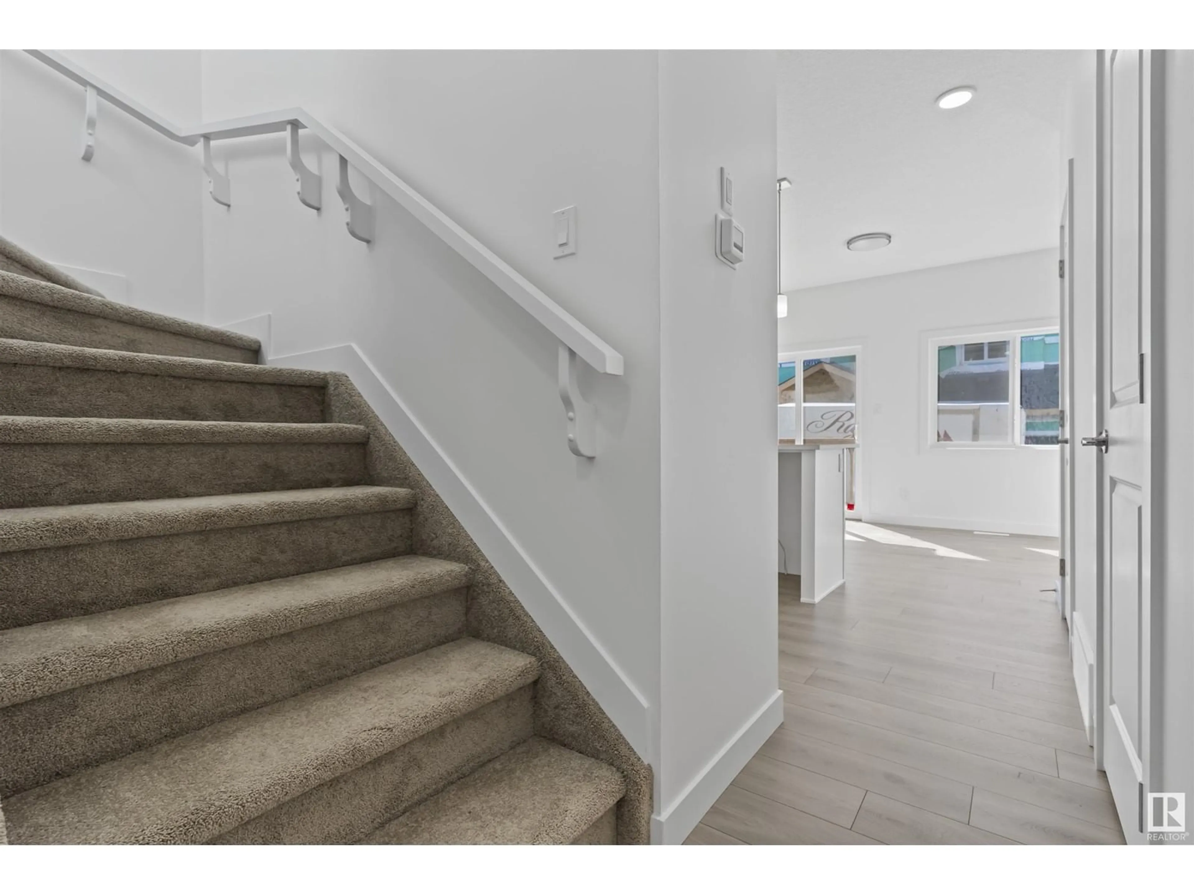 Indoor foyer, wood floors for #30 740 Daniels Way SW, Edmonton Alberta T6W5N1