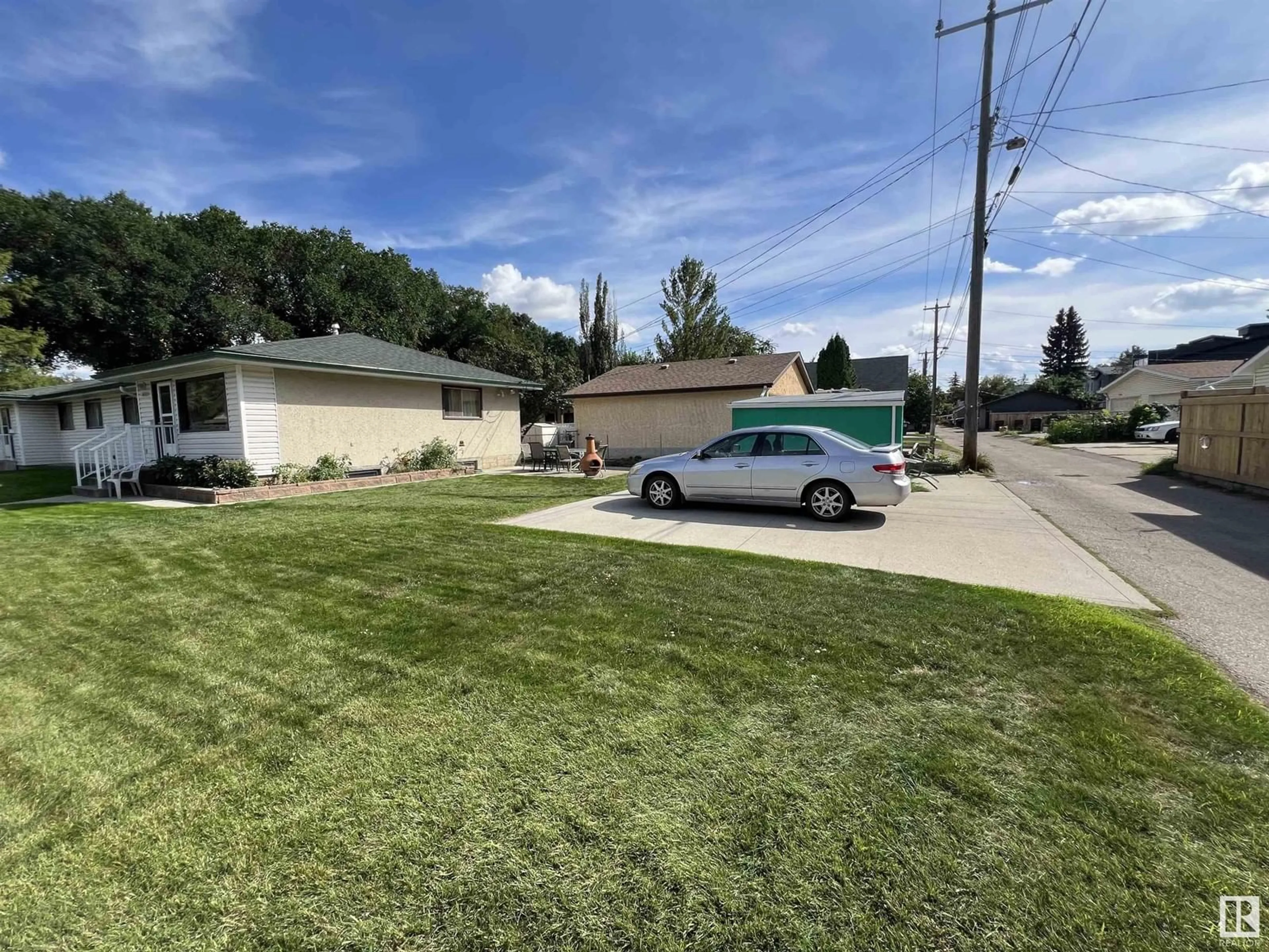 Frontside or backside of a home, the street view for 8805 102 AV NW, Edmonton Alberta T5H0E1