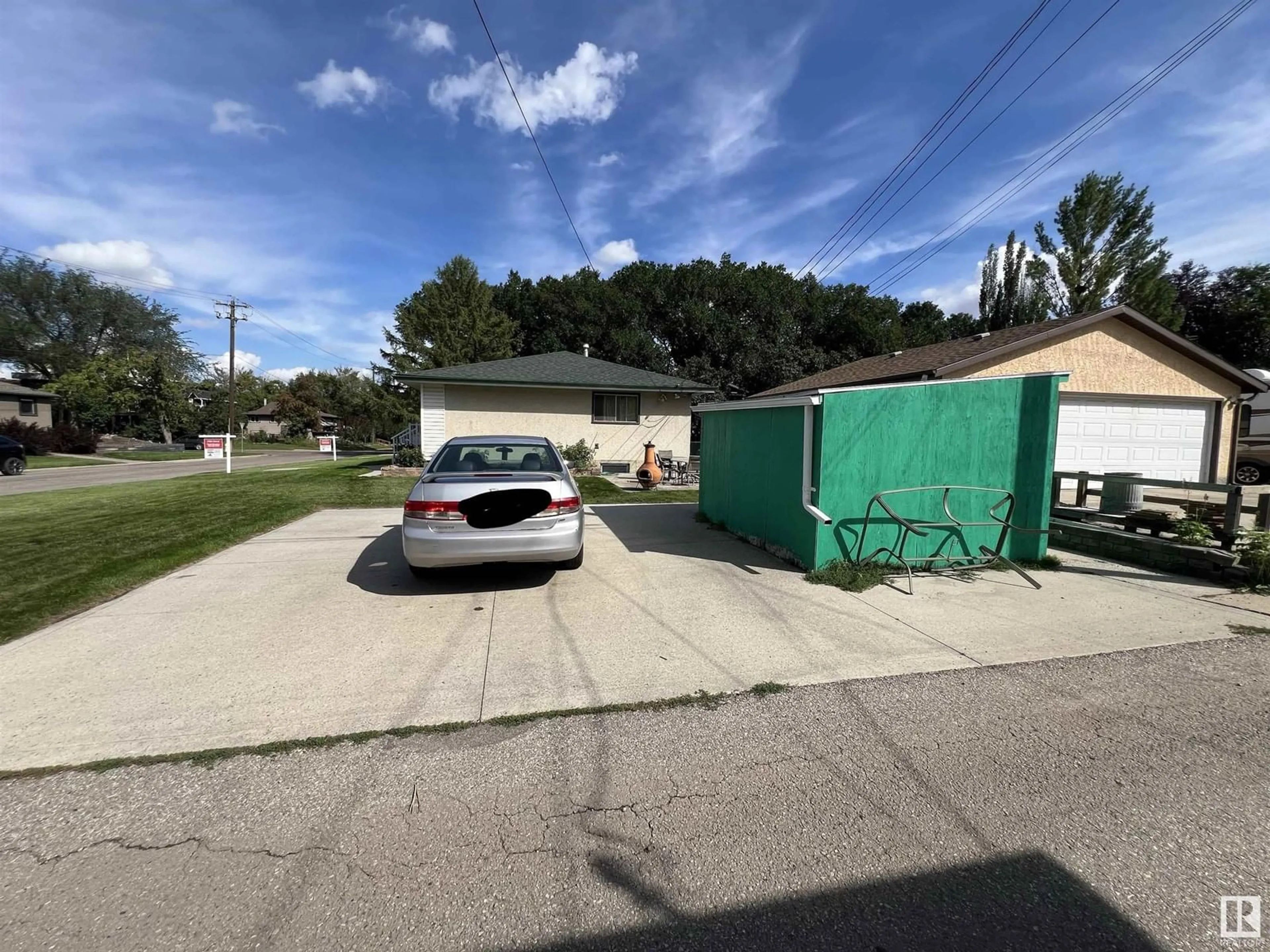 Frontside or backside of a home, the street view for 8805 102 AV NW, Edmonton Alberta T5H0E1