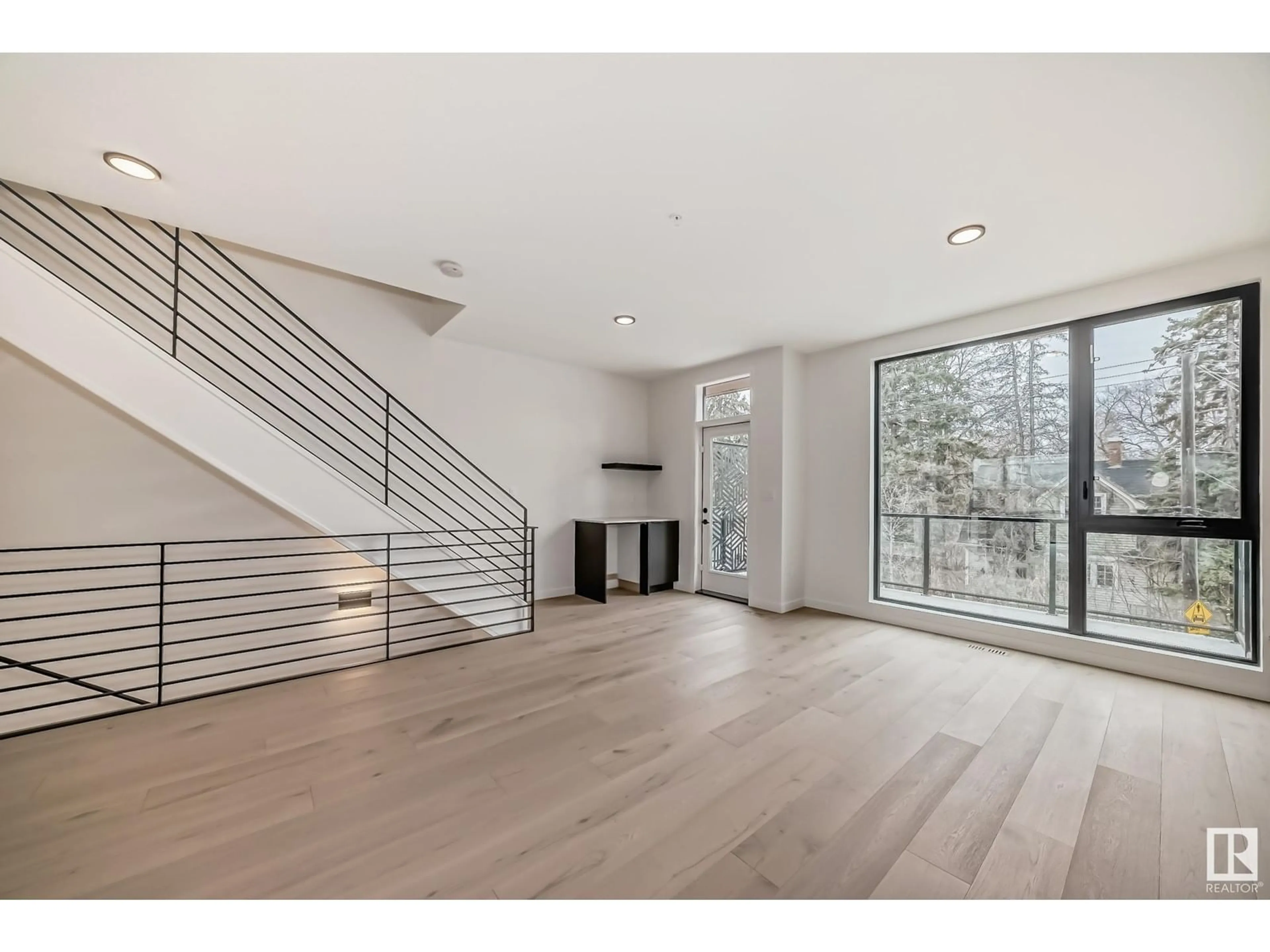 Indoor foyer, wood floors for 10341 Wadhurst RD NW, Edmonton Alberta T5N1T1