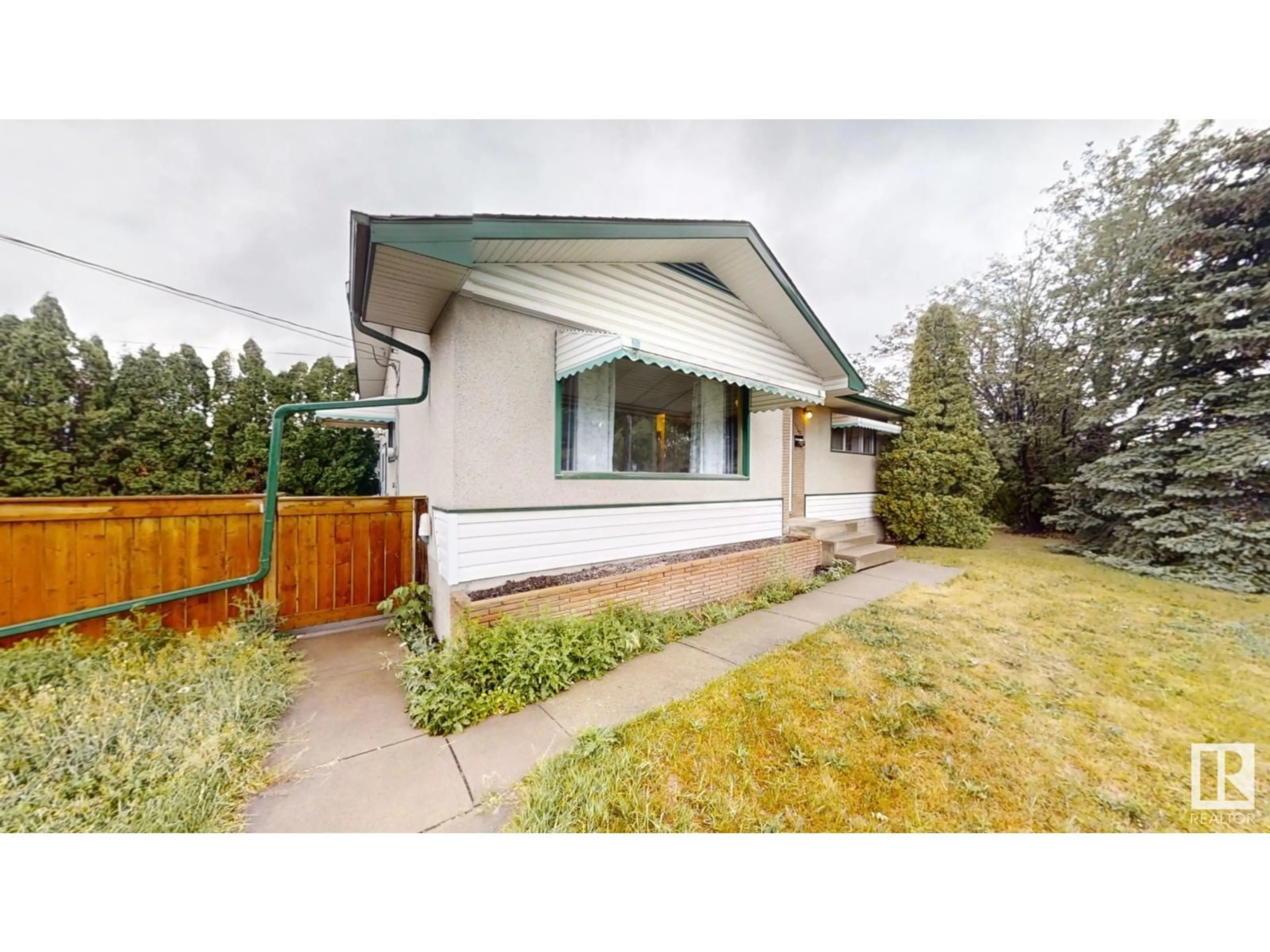 Frontside or backside of a home, cottage for 12604 130 AV NW, Edmonton Alberta T5L3L3