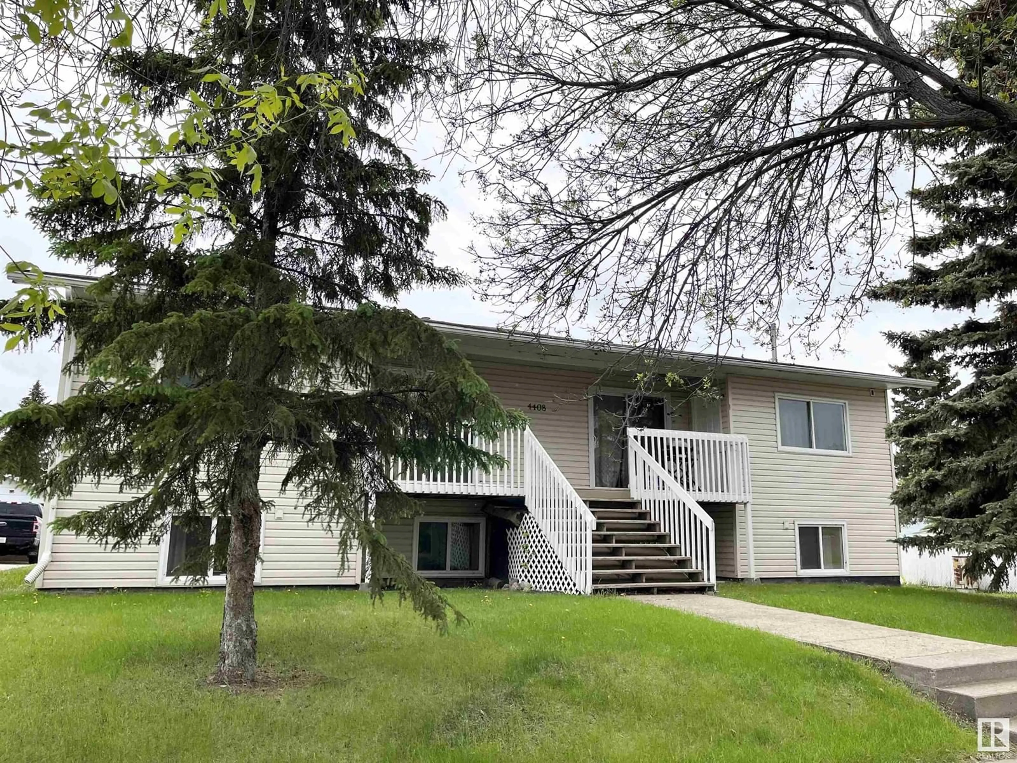 Home with vinyl exterior material, street for 4408 49 AV, Bonnyville Town Alberta T9N1G9