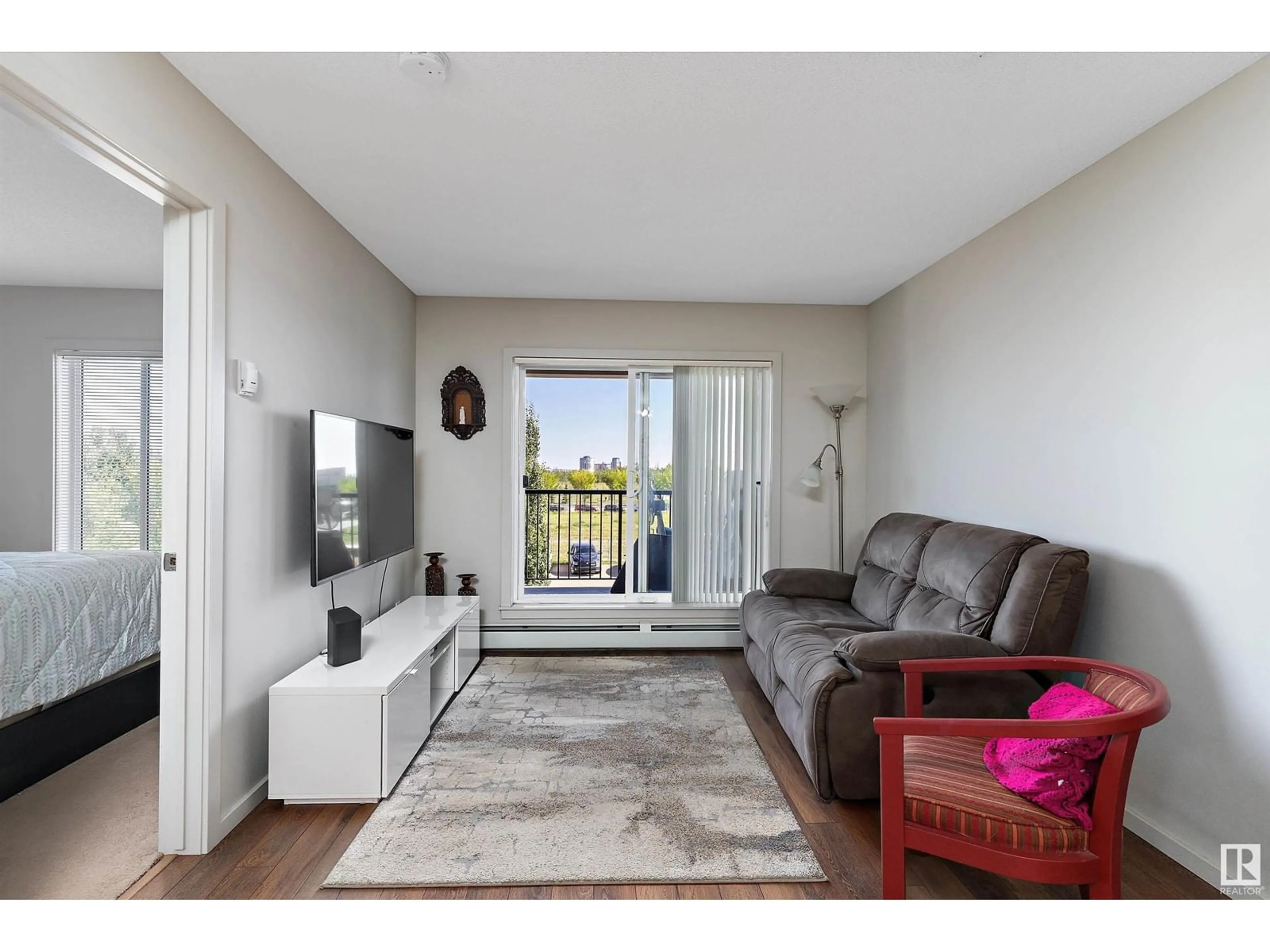 Living room, wood floors for #334 390 WINDERMERE RD NW, Edmonton Alberta T6W0R1