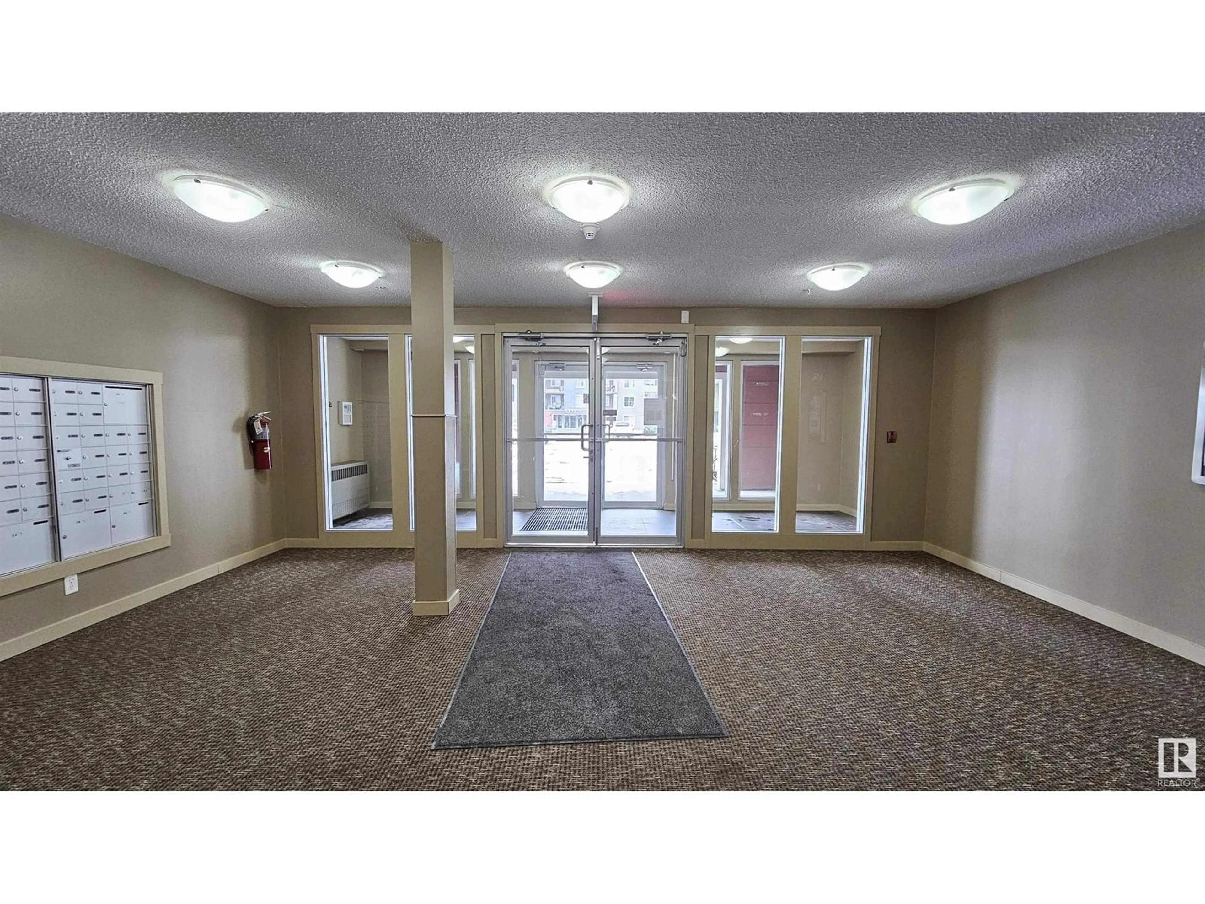 Indoor foyer, carpet floors for #415 3207 JAMES MOWATT TR SW, Edmonton Alberta T6W3L6