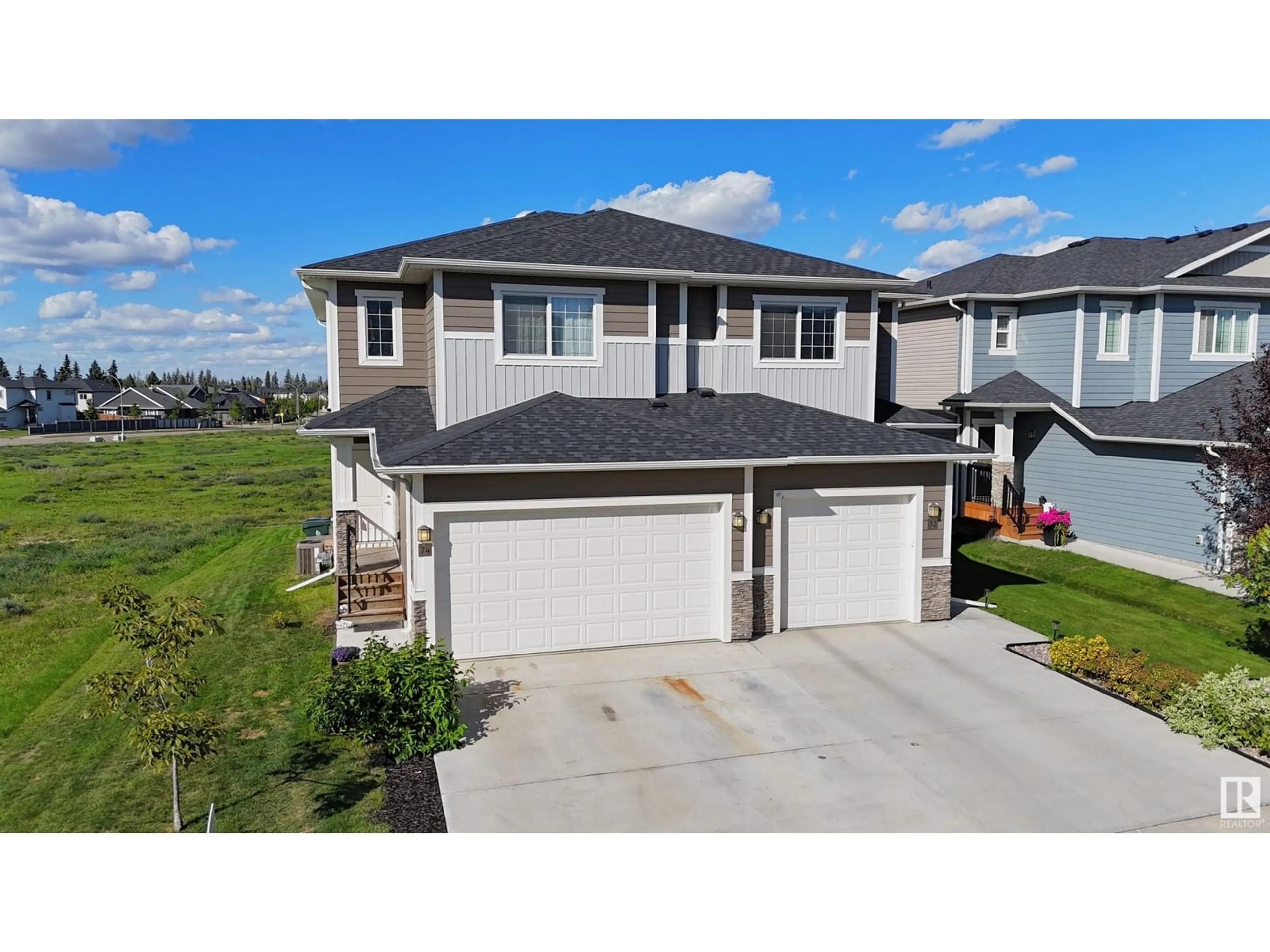 Frontside or backside of a home for 74 HAZELWOOD LN, Spruce Grove Alberta T7X0R7