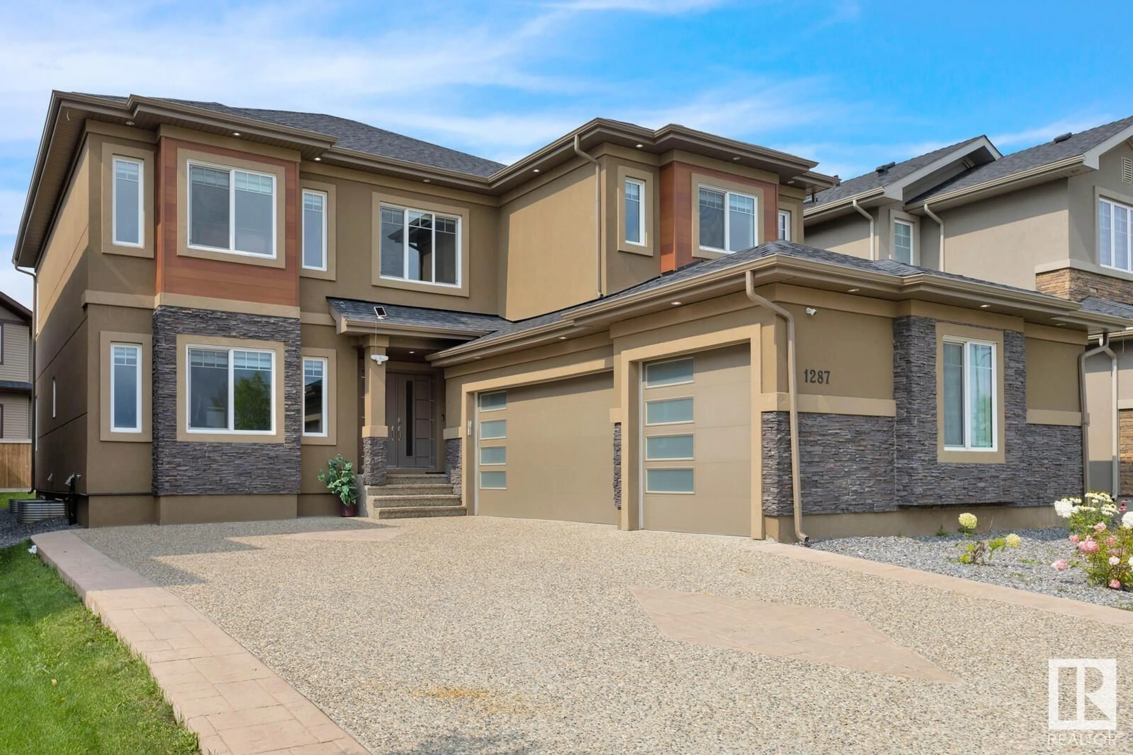 Frontside or backside of a home, the street view for 1287 ADAMSON DR SW, Edmonton Alberta T6W1A8