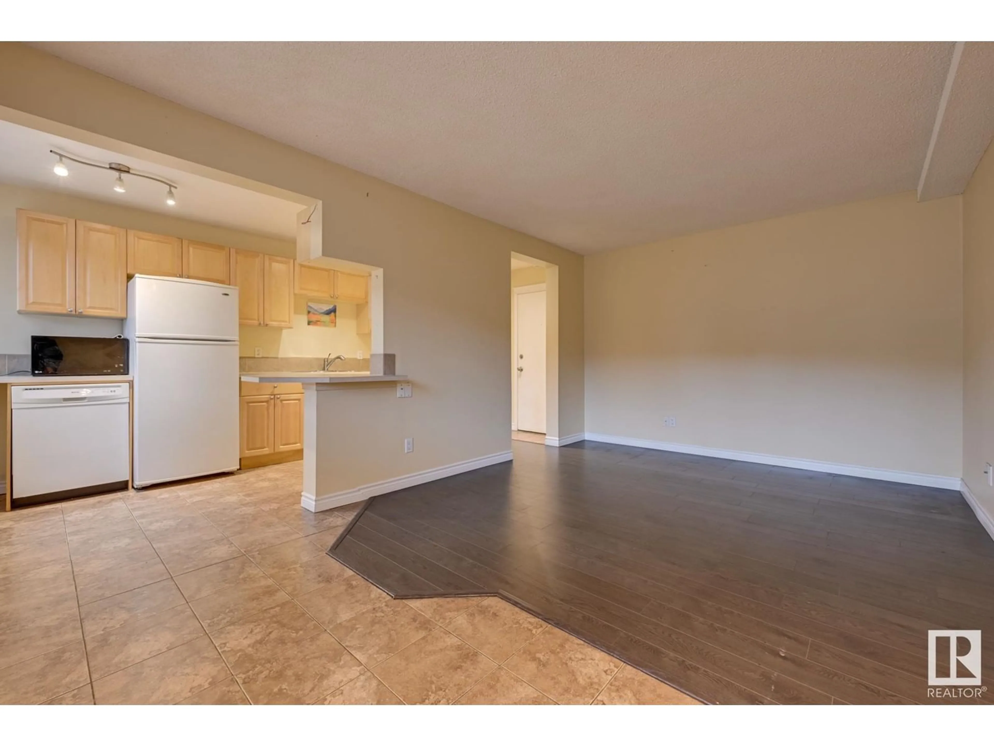 A pic of a room, wood floors for #105 10621 79 AV NW, Edmonton Alberta T6E1S2