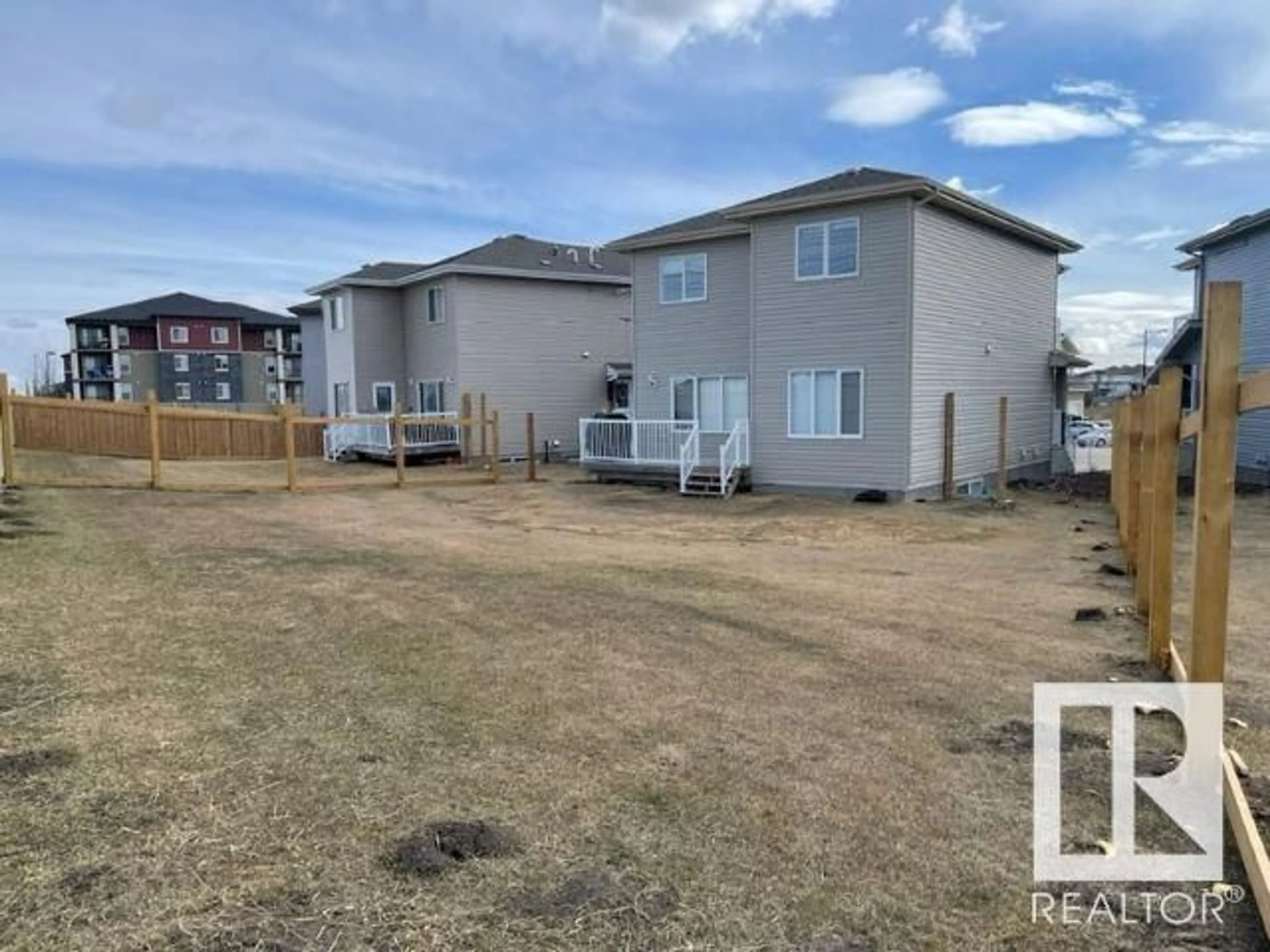 Frontside or backside of a home, the fenced backyard for 7315 CREIGHTON CL SW, Edmonton Alberta T6W3J6