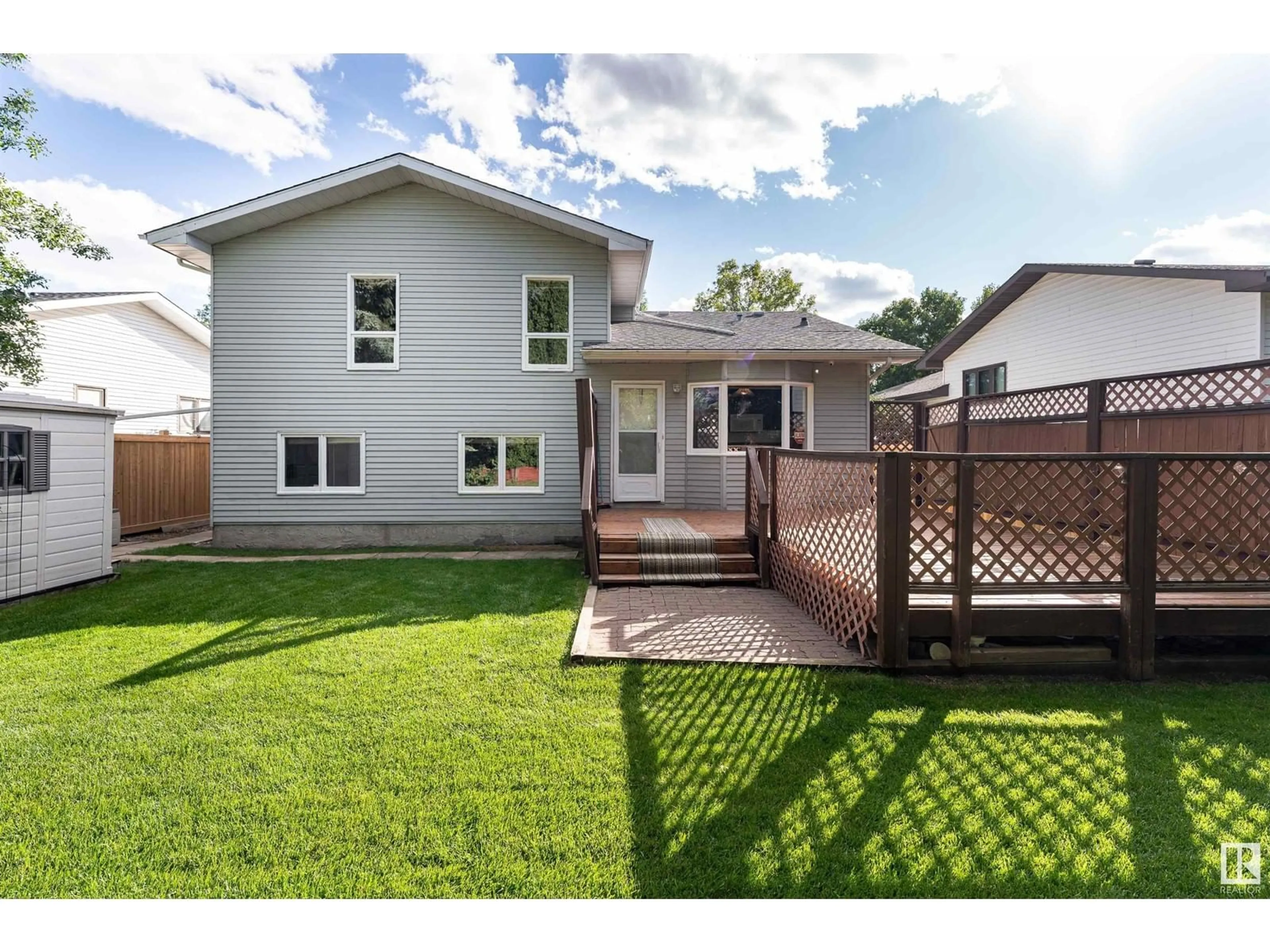 Frontside or backside of a home, the fenced backyard for 26 LENNOX DR, St. Albert Alberta T8N4L6