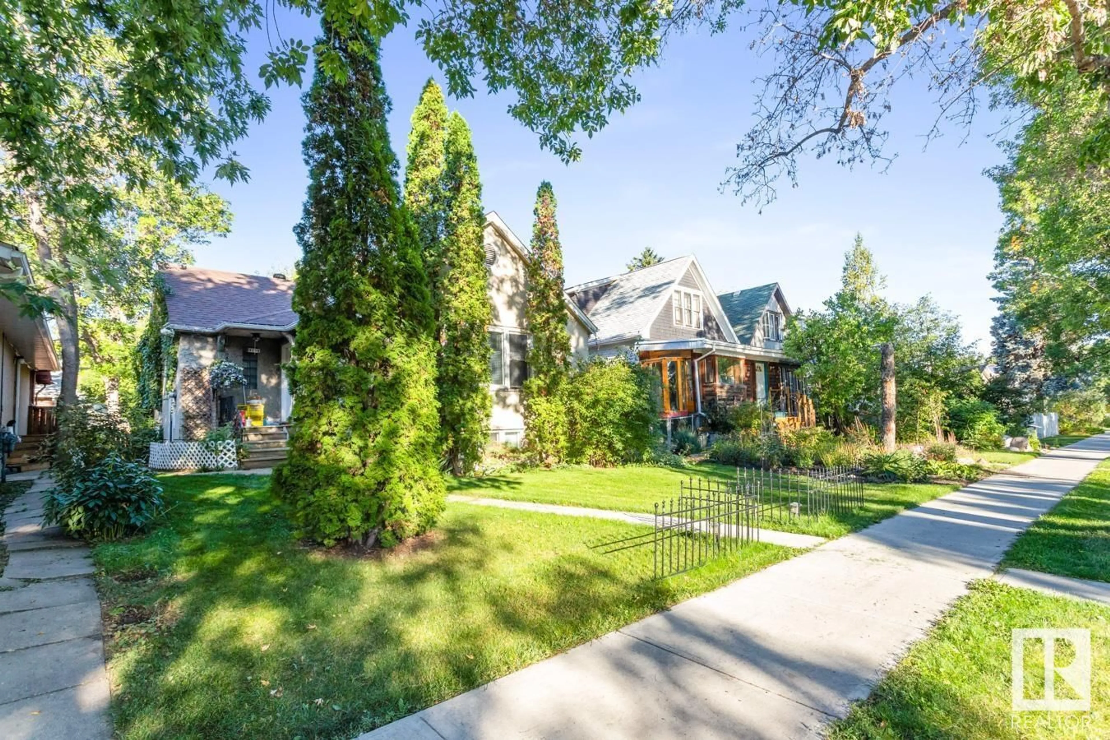 Frontside or backside of a home, the fenced backyard for 10910 122 ST NW, Edmonton Alberta T5M0A8