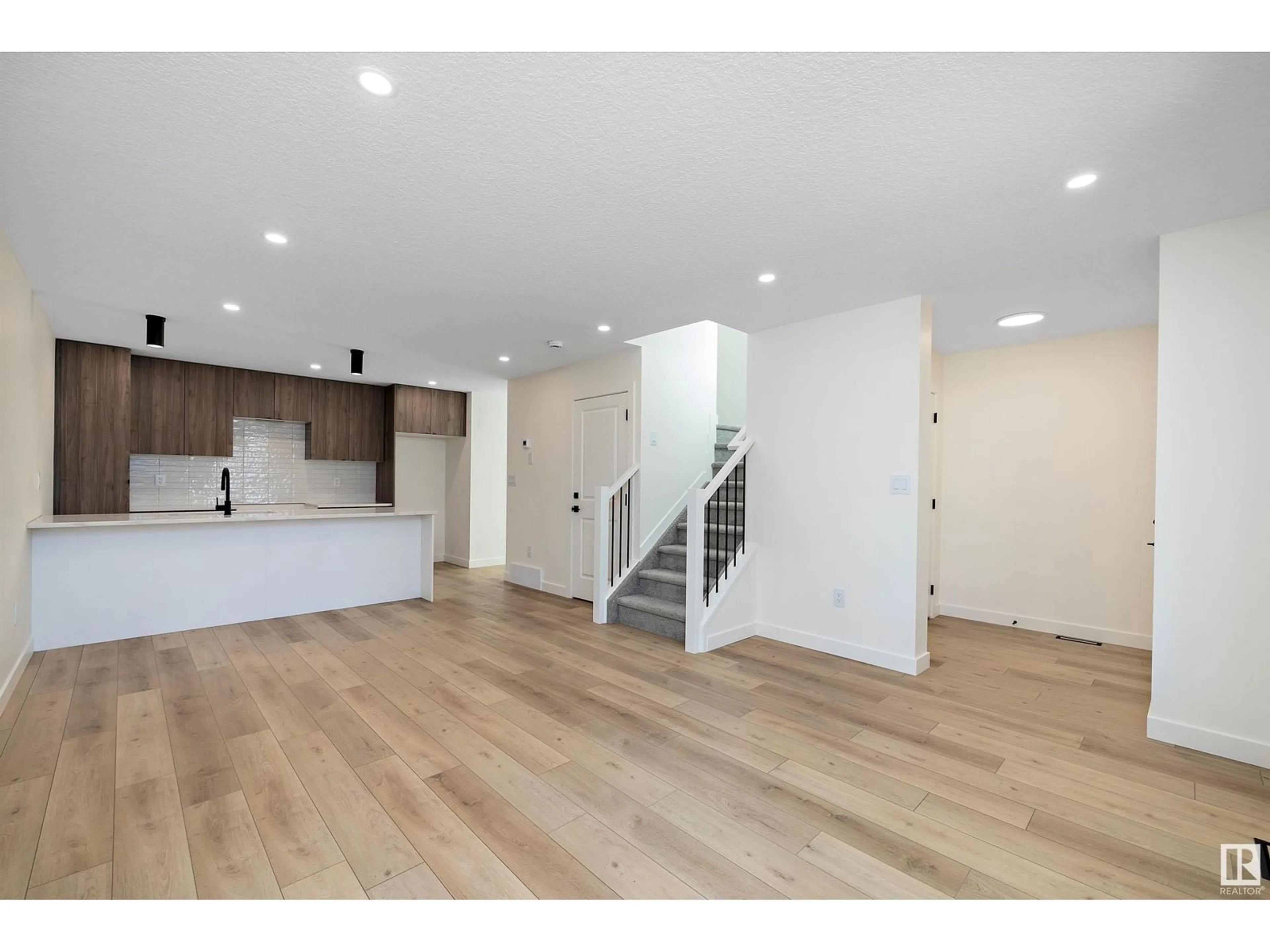 Open concept kitchen, wood/laminate floor for NW - 11738 91 ST, Edmonton Alberta T5B4B3