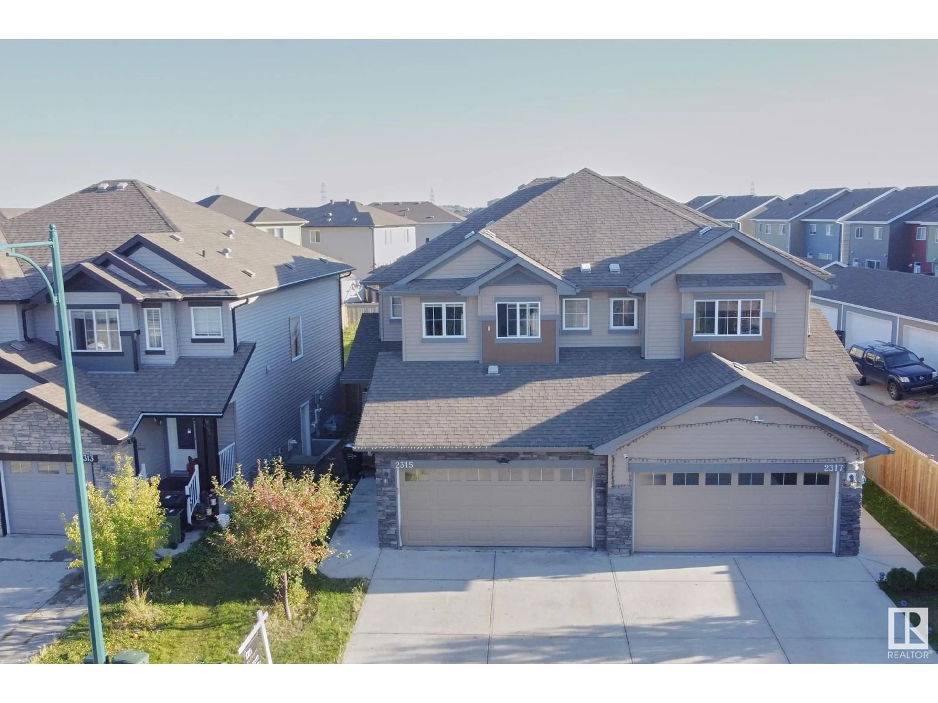 Frontside or backside of a home, the street view for 2315 22 AV NW, Edmonton Alberta T6T0Y4