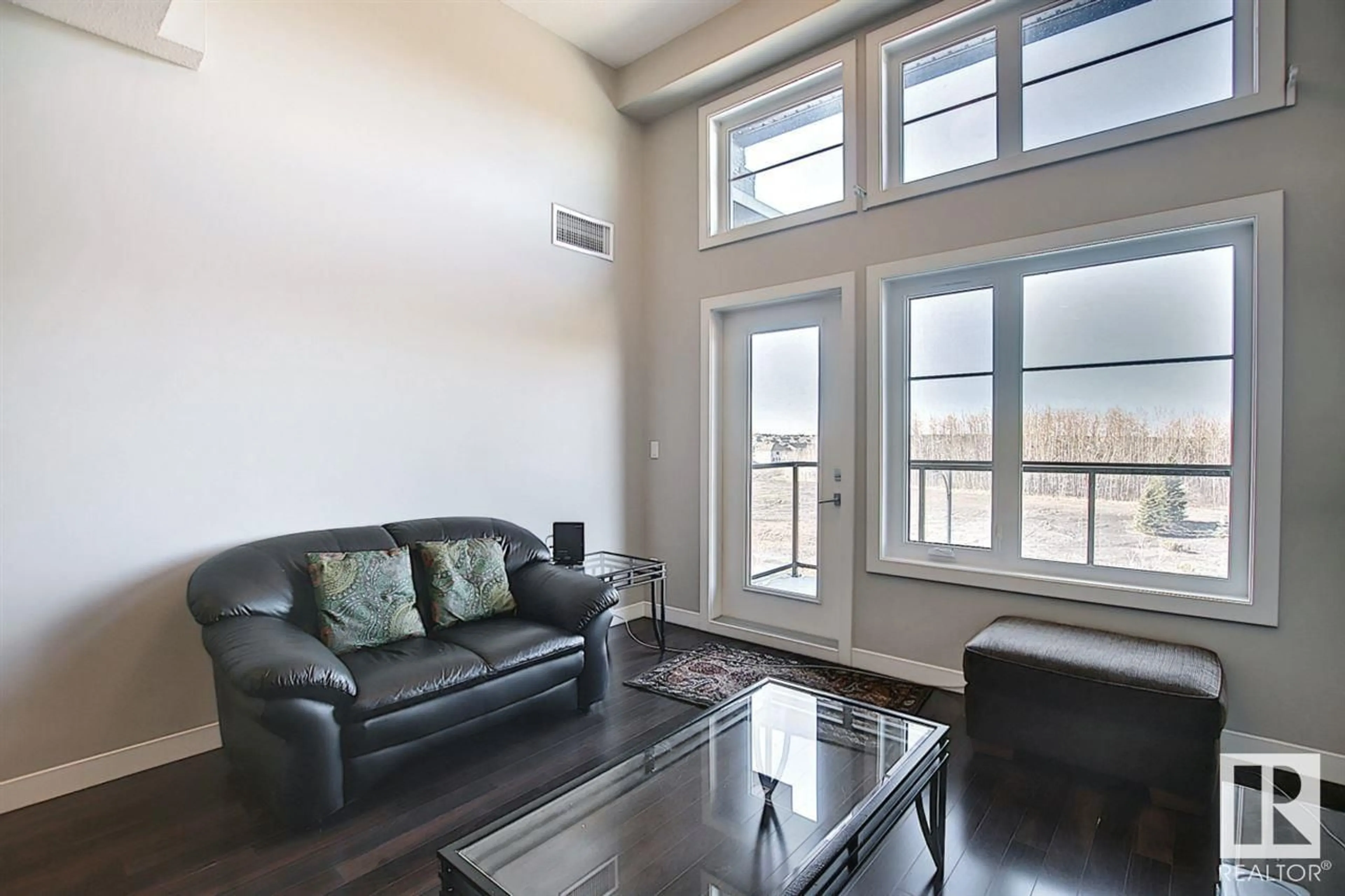 Living room, wood floors for #409 5029 EDGEMONT BV NW, Edmonton Alberta T6M0S8