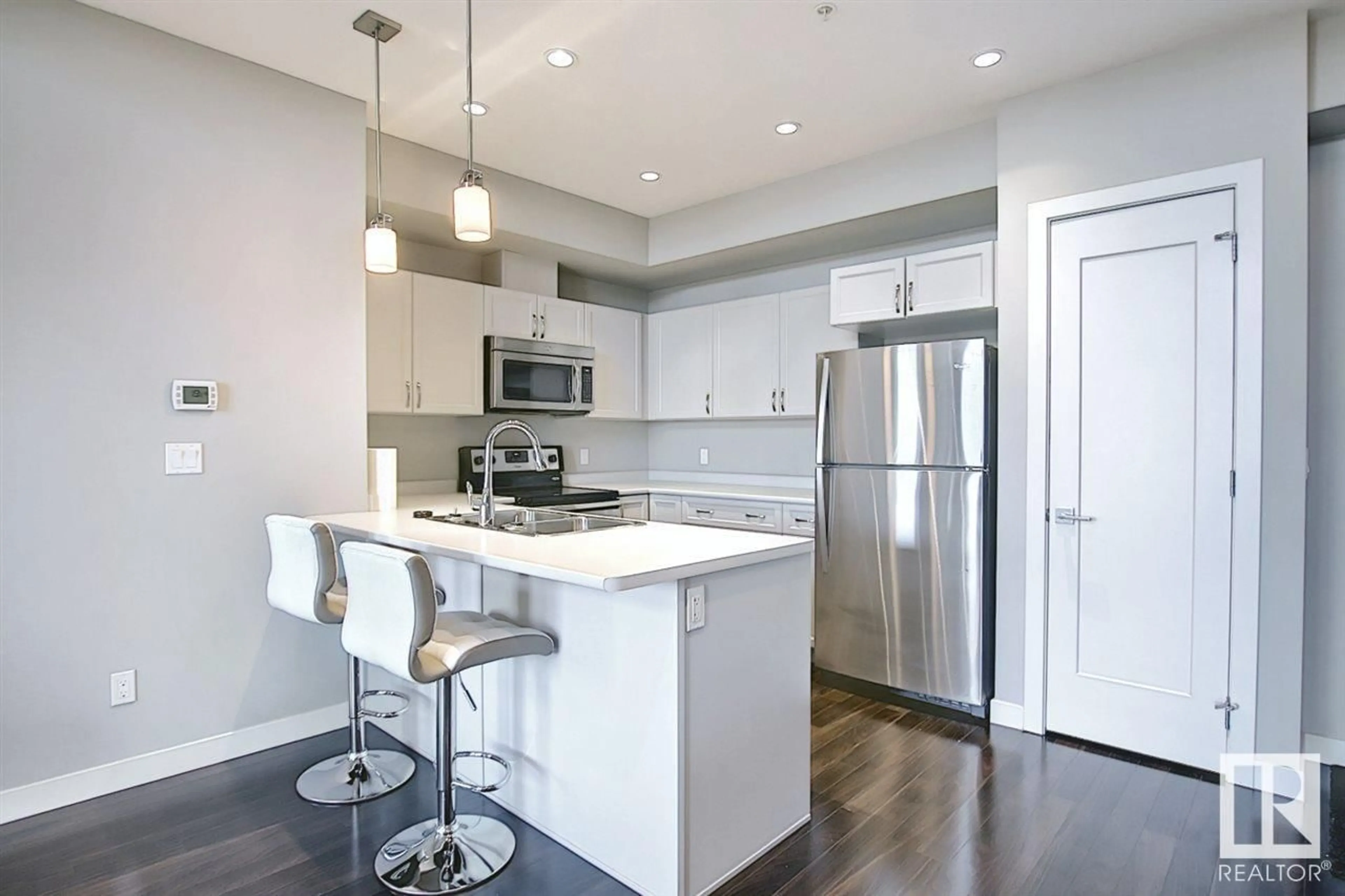 Open concept kitchen for #409 5029 EDGEMONT BV NW, Edmonton Alberta T6M0S8