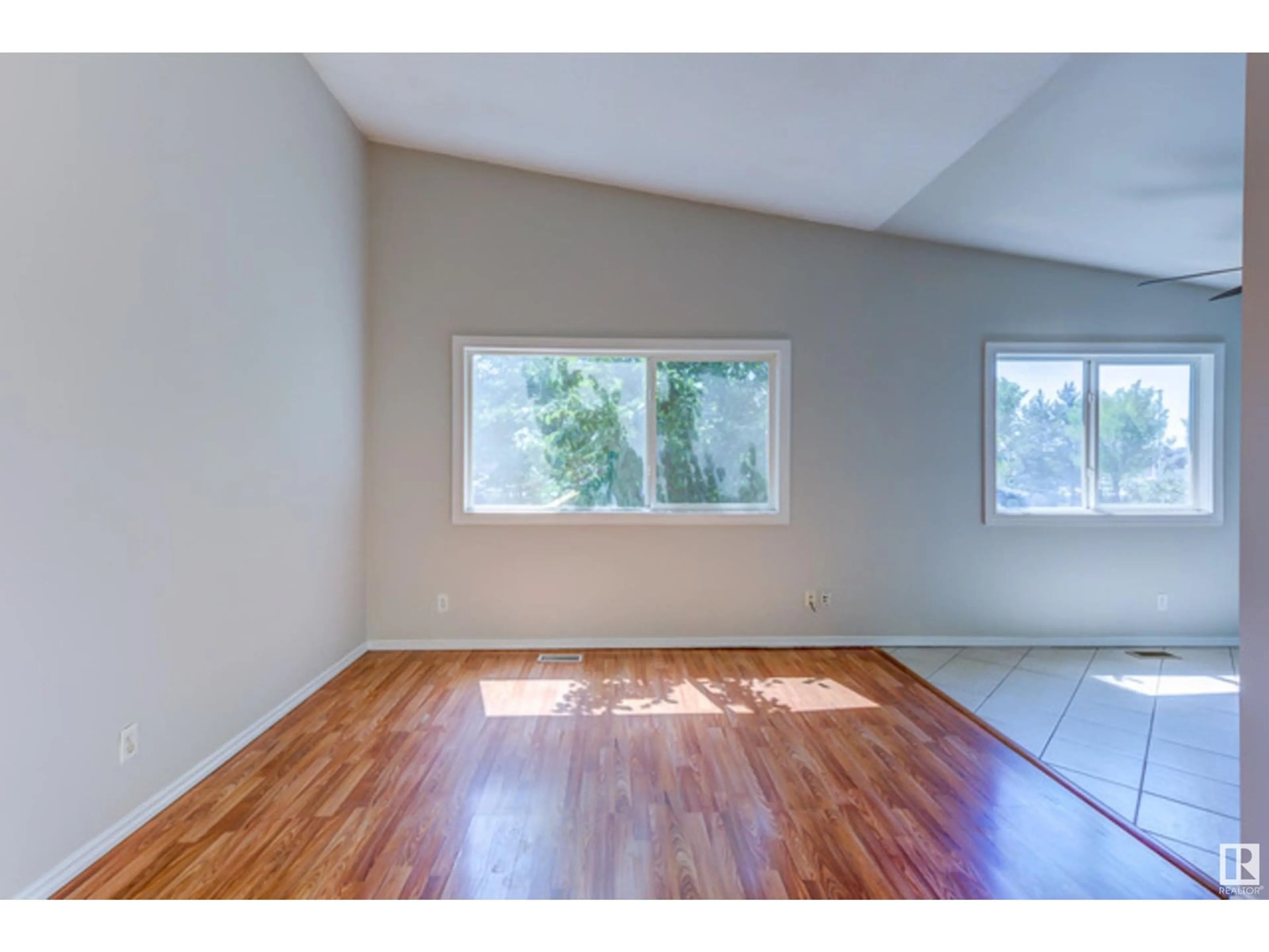 A pic of a room, wood floors for 9516 127 AV NW, Edmonton Alberta T5E0B6