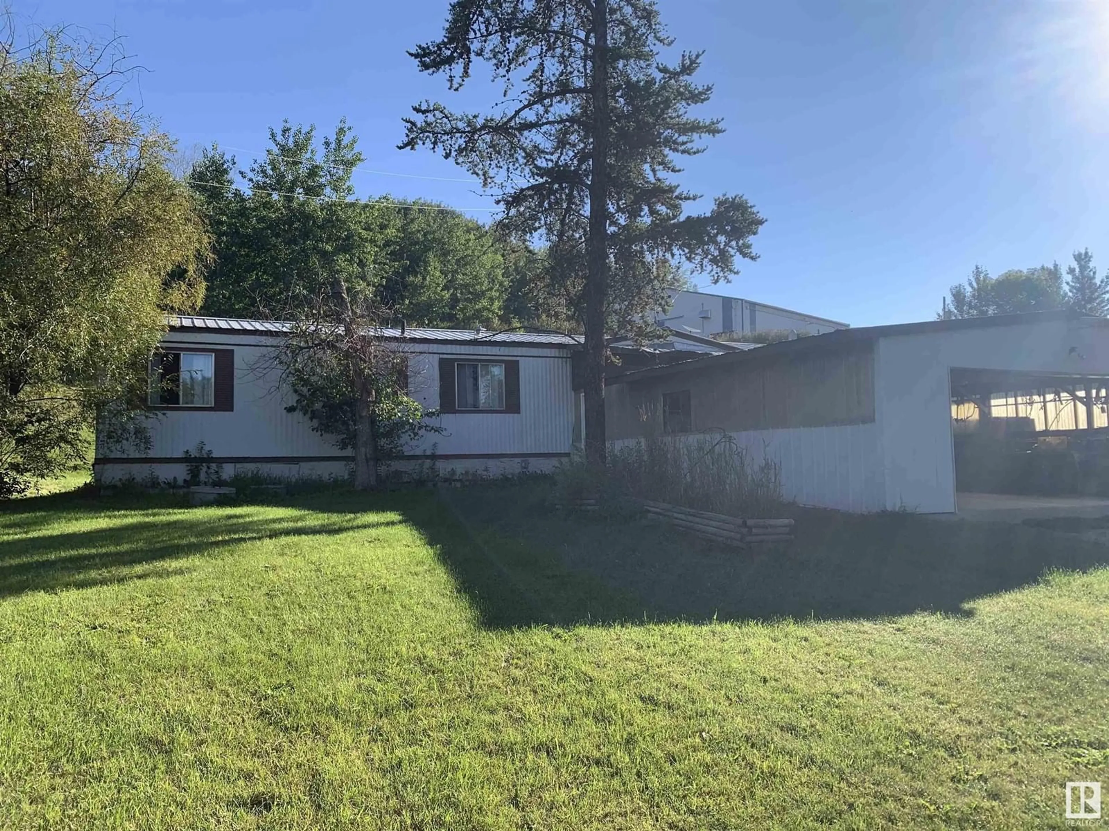 A pic from outside/outdoor area/front of a property/back of a property/a pic from drone, unknown for 102 1A AV, Rural Parkland County Alberta T0E0V0