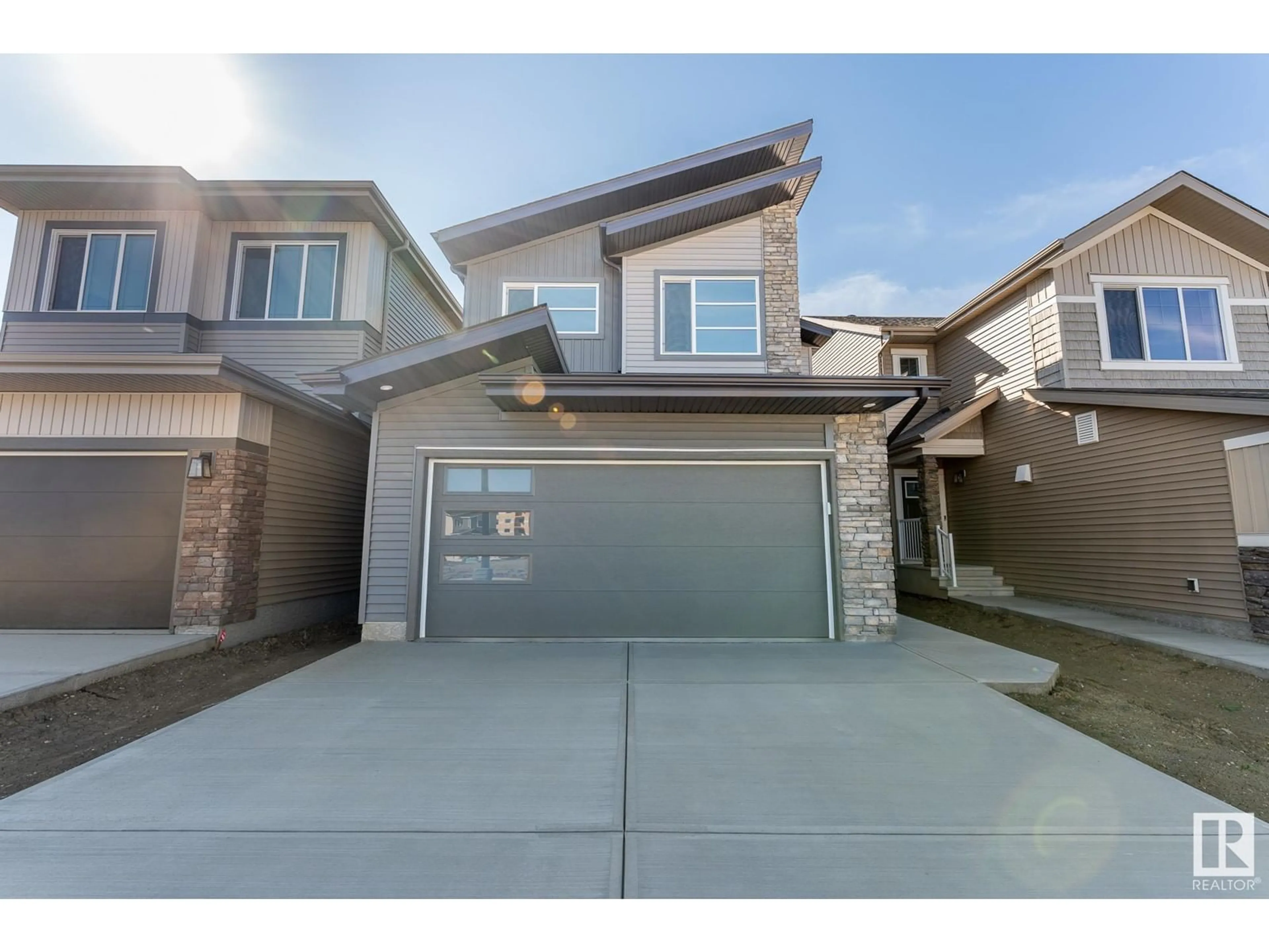 Frontside or backside of a home, the street view for 2416 206 ST NW, Edmonton Alberta T6M1N6