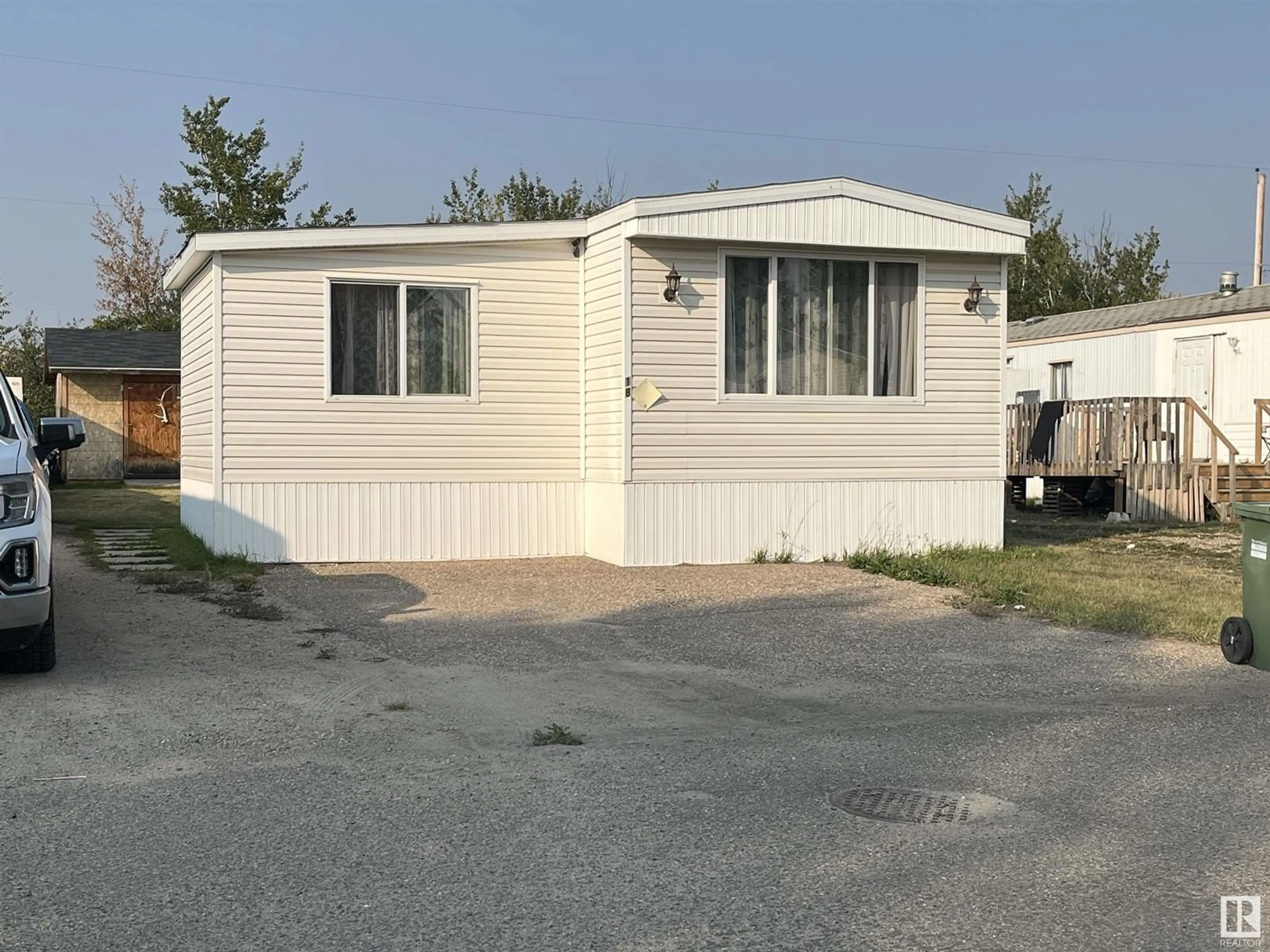 Home with vinyl exterior material for 18 Sportsman Trailer Park, Bonnyville Town Alberta T9N2H6