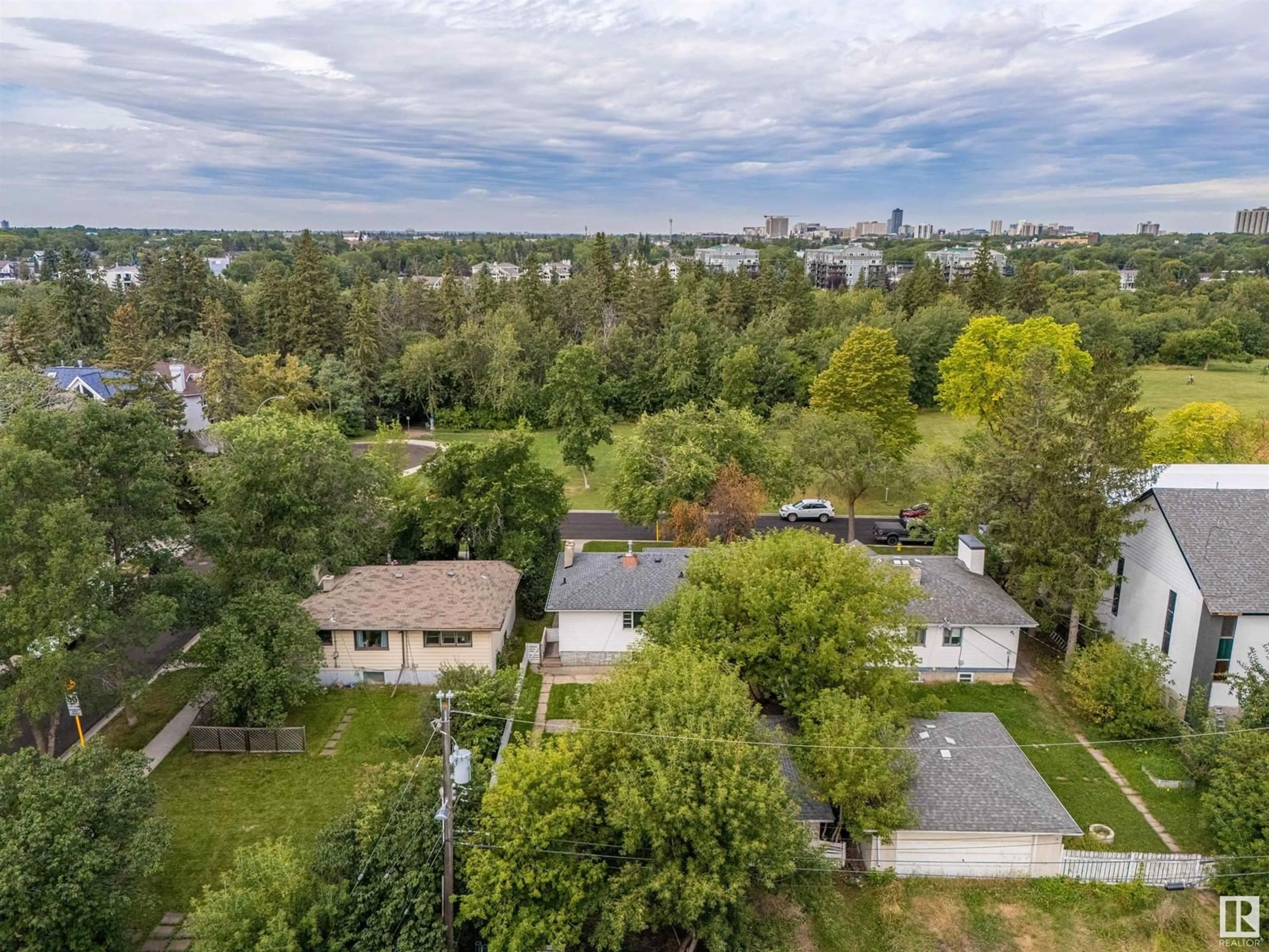 Frontside or backside of a home, the fenced backyard for 7807 93 ST NW, Edmonton Alberta T6C3S5