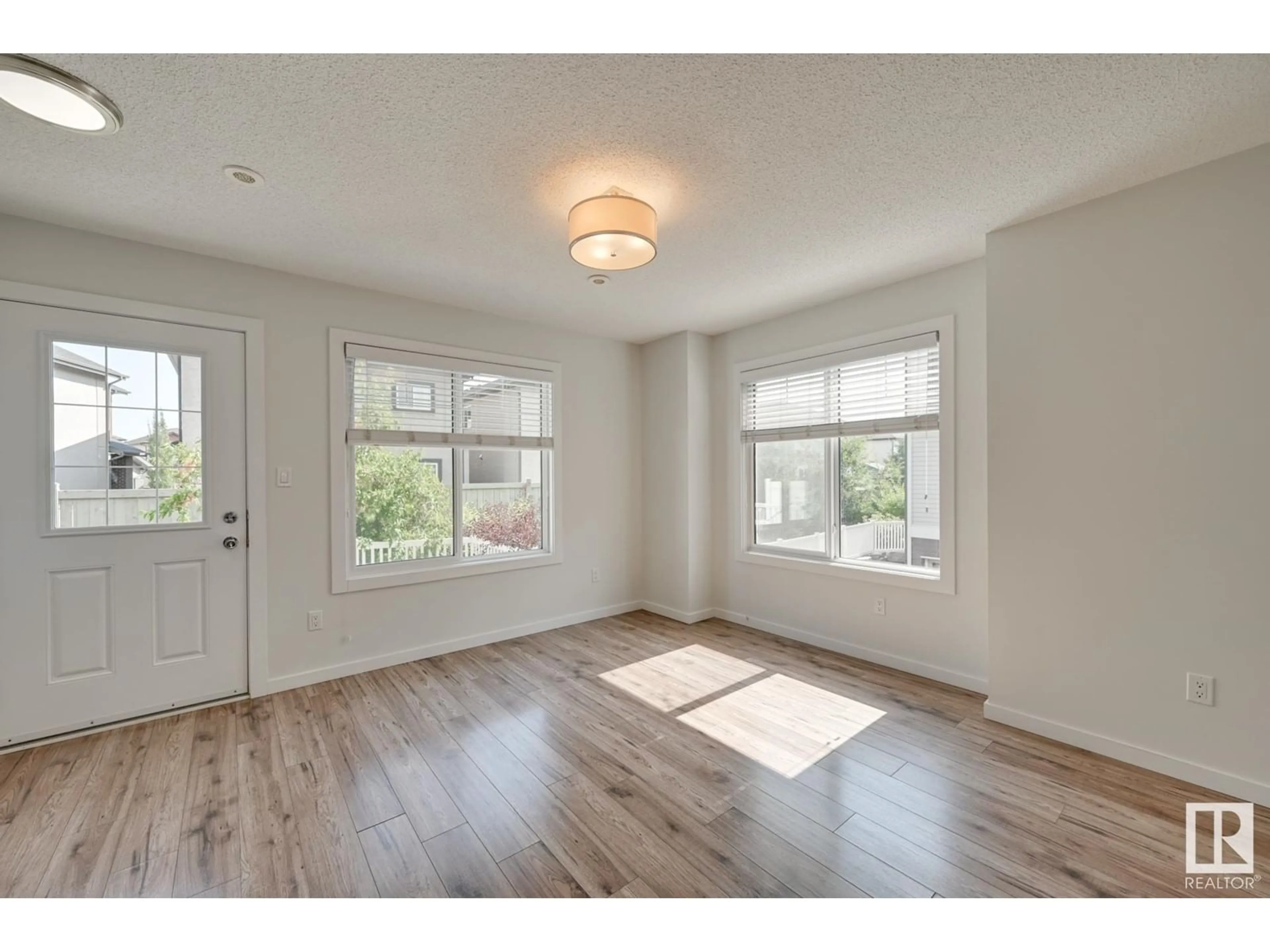 A pic of a room, wood floors for #26 2215 24 ST NW, Edmonton Alberta T6T1A6