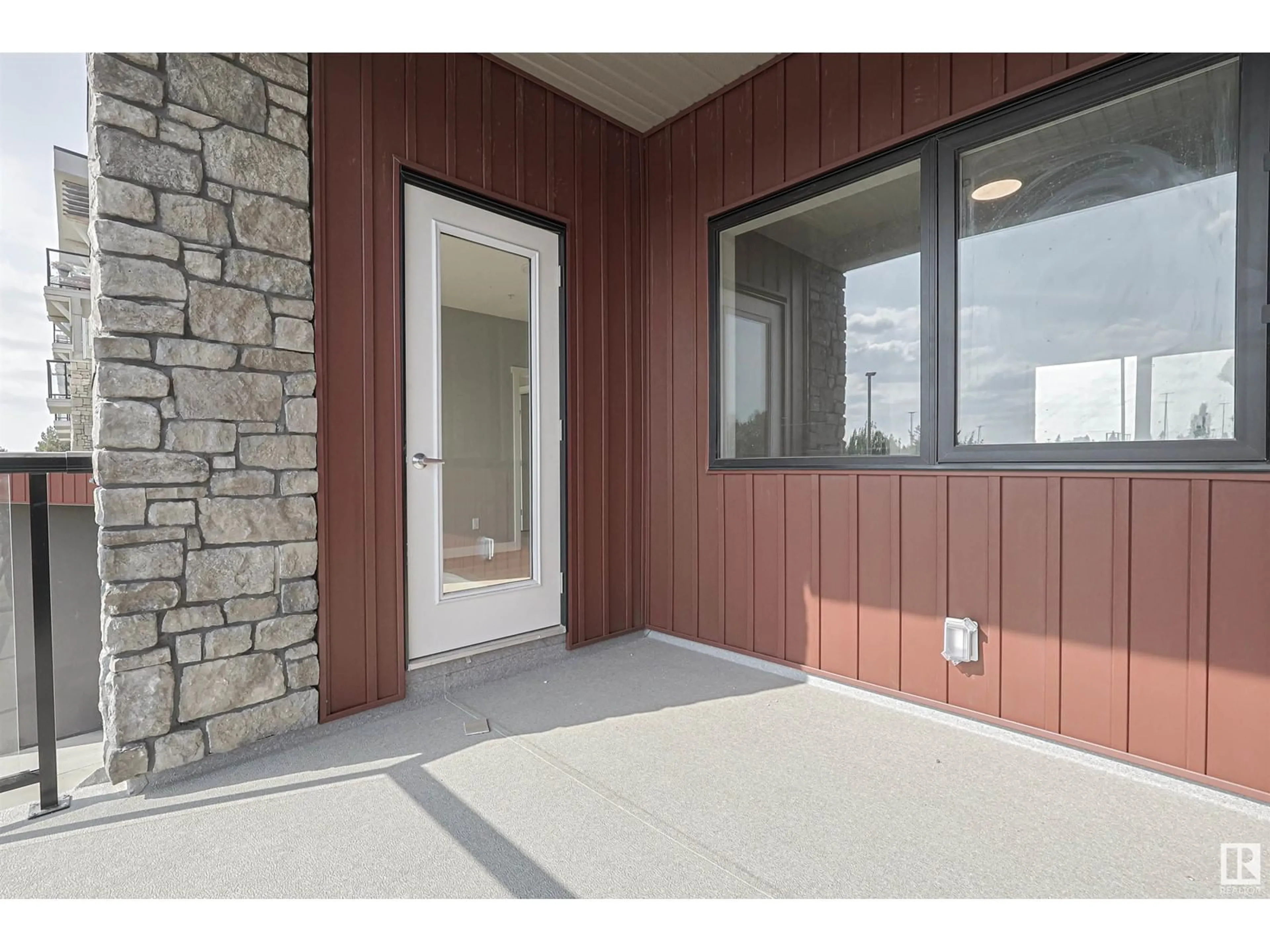 Indoor entryway, cement floor for #217 12804 140 AV NW, Edmonton Alberta T6V1K4