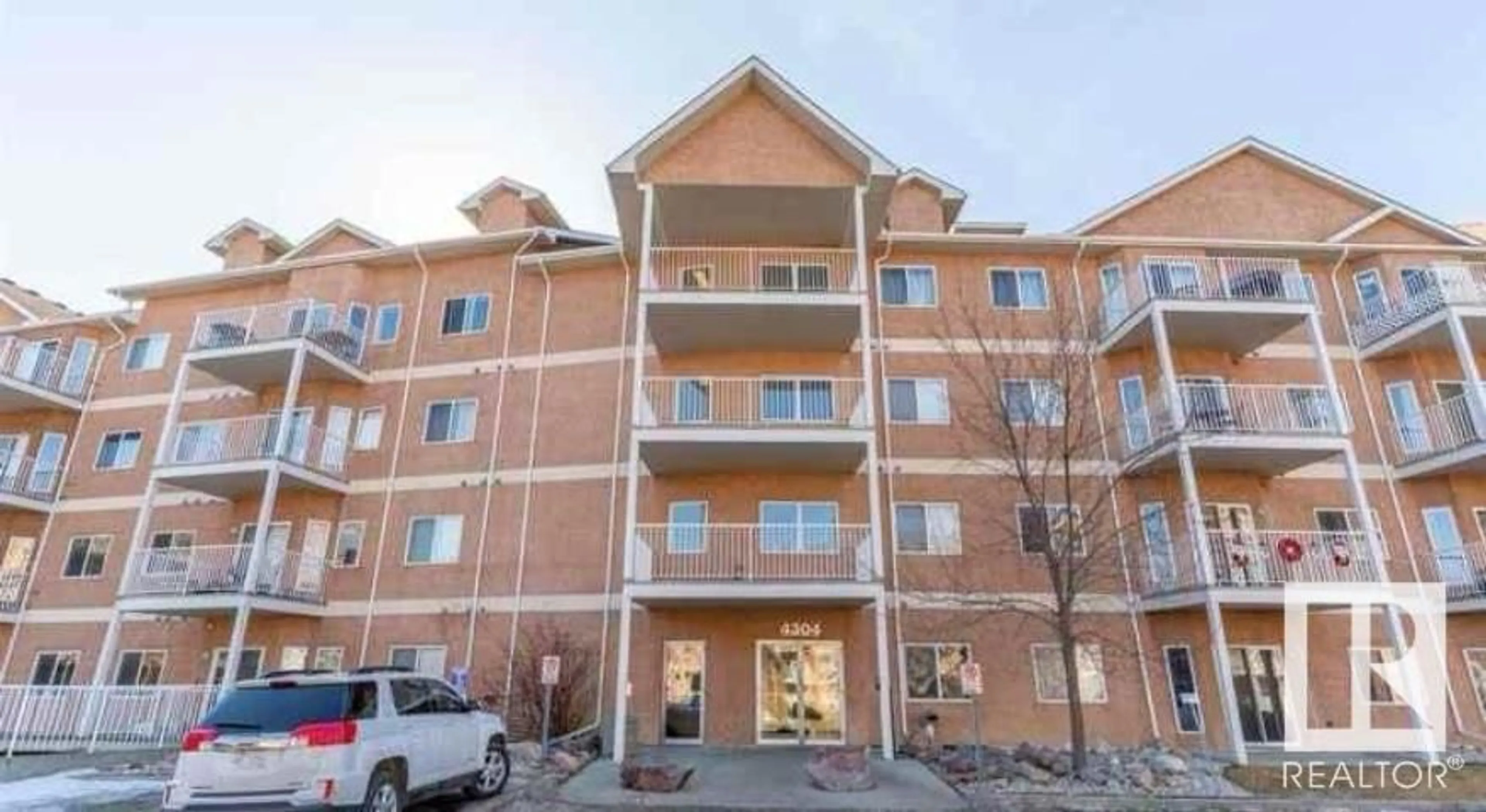 A pic from exterior of the house or condo, the front or back of building for #122 4304 139 AV NW, Edmonton Alberta T5Y0H6