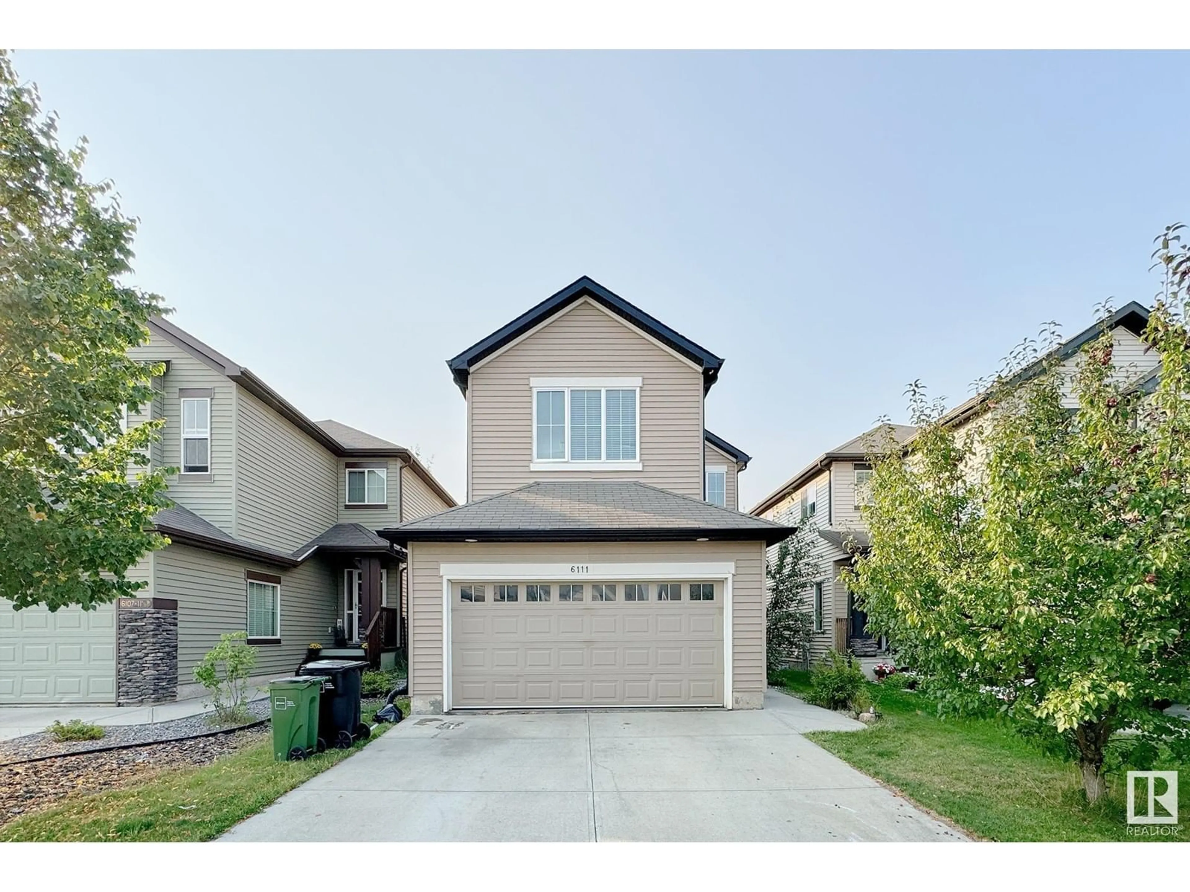 Frontside or backside of a home, the street view for 6111 11 AV SW, Edmonton Alberta T6X0M4