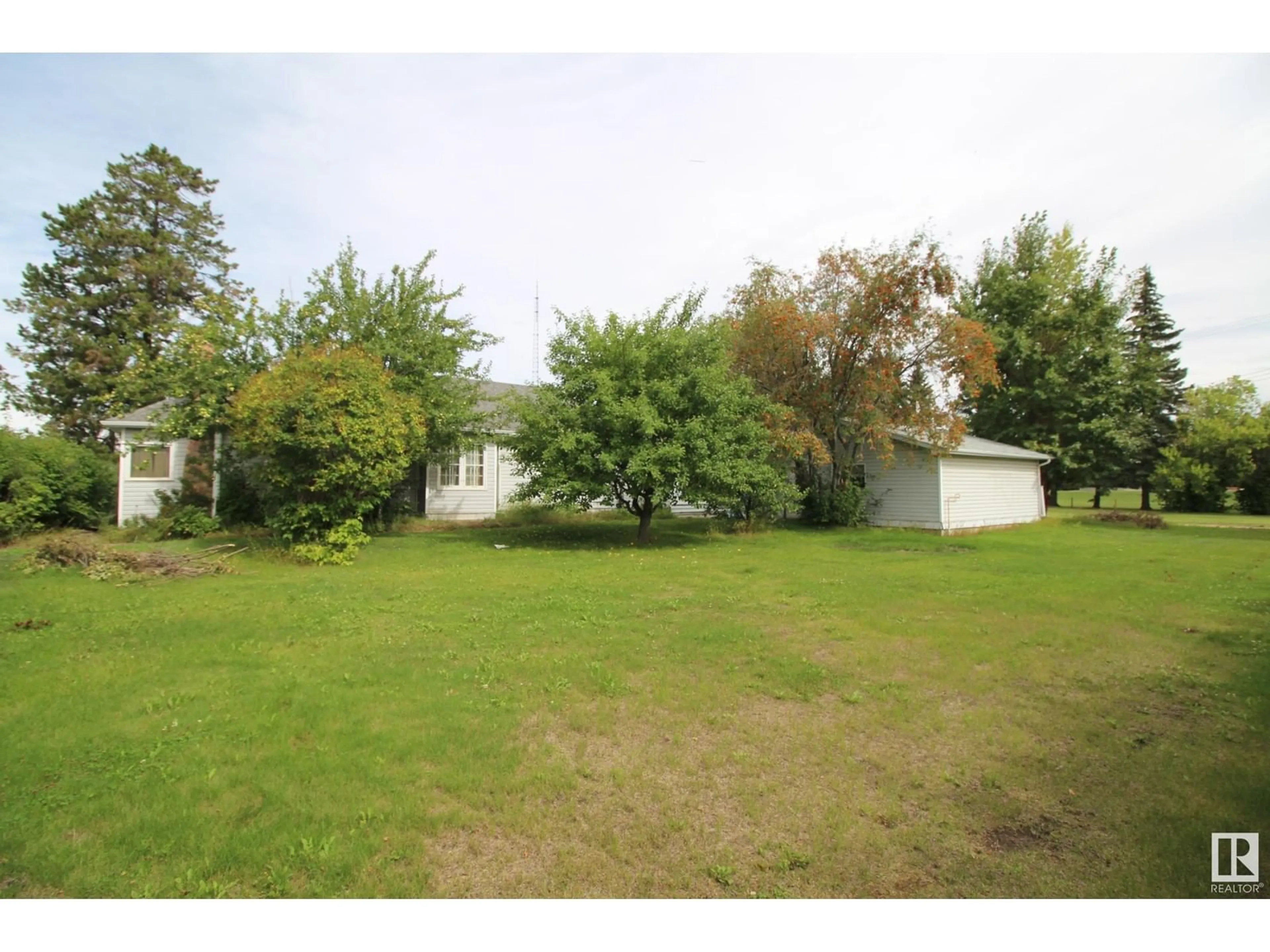 Frontside or backside of a home, the fenced backyard for 5105 50 Street, Rimbey Alberta T0C2J0