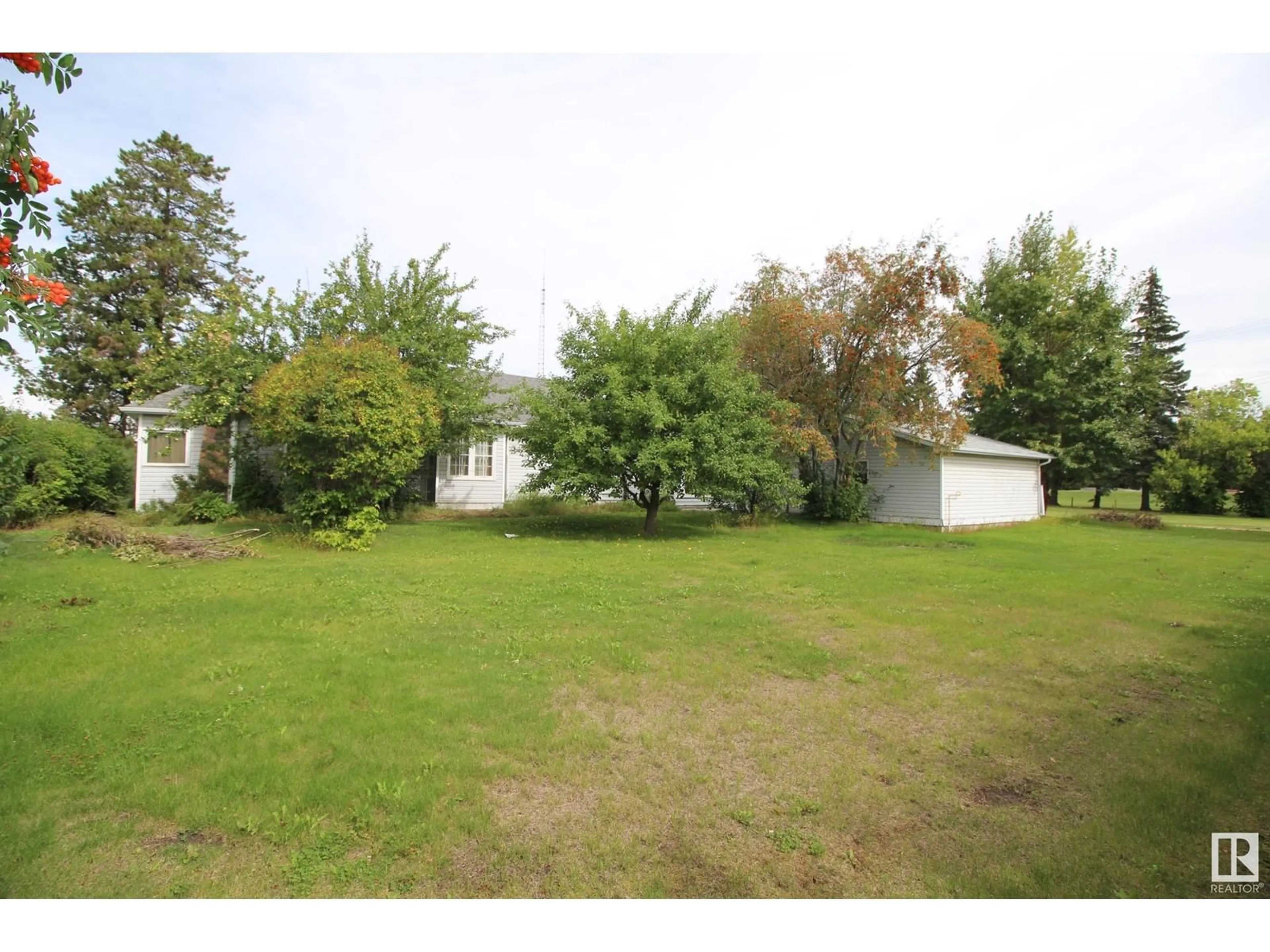 Frontside or backside of a home, the fenced backyard for 5105 50 Street, Rimbey Alberta T0C2J0