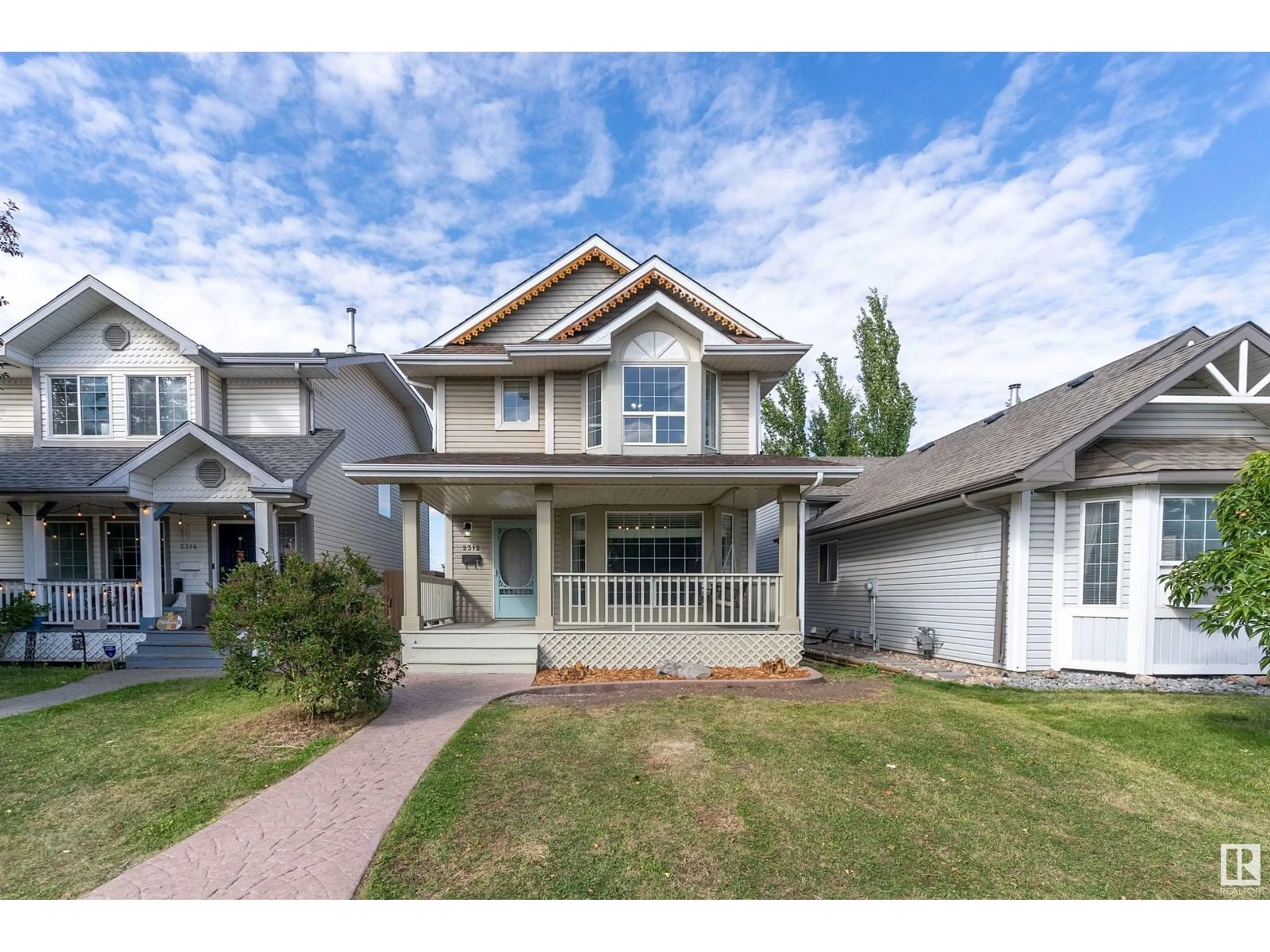 Frontside or backside of a home, the street view for 2312 39 AV NW, Edmonton Alberta T6T1K7