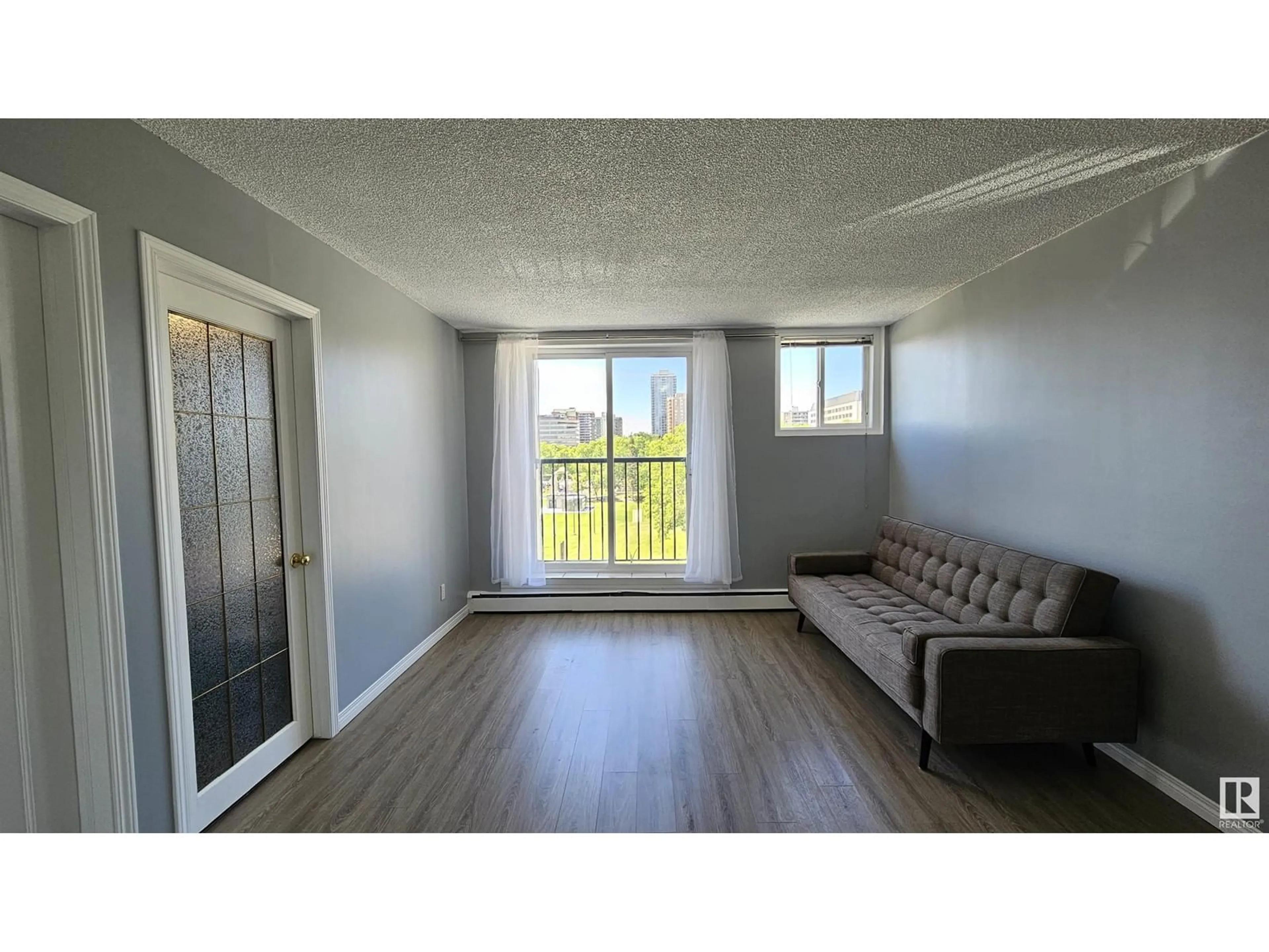 A pic of a room, wood floors for #501 9730 106 ST NW, Edmonton Alberta T5K1B7