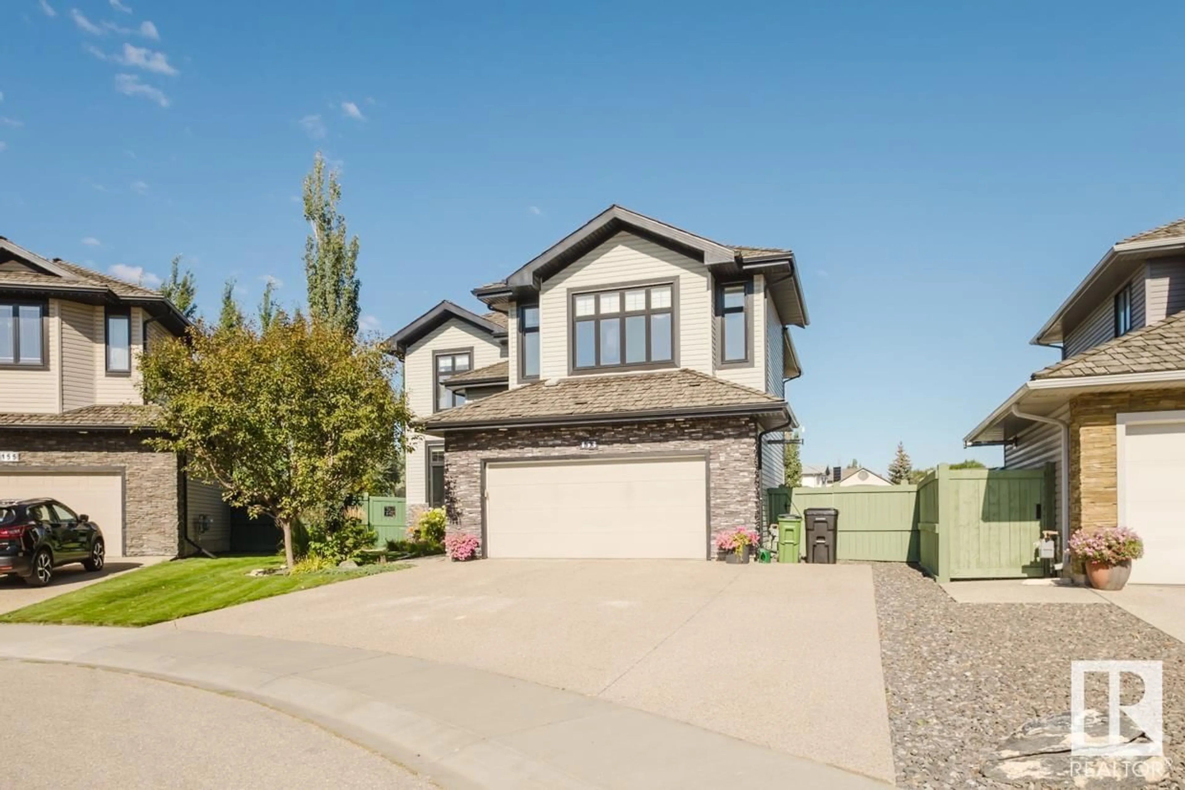 Frontside or backside of a home, the street view for 153 WEBER CL NW, Edmonton Alberta T6M0L4