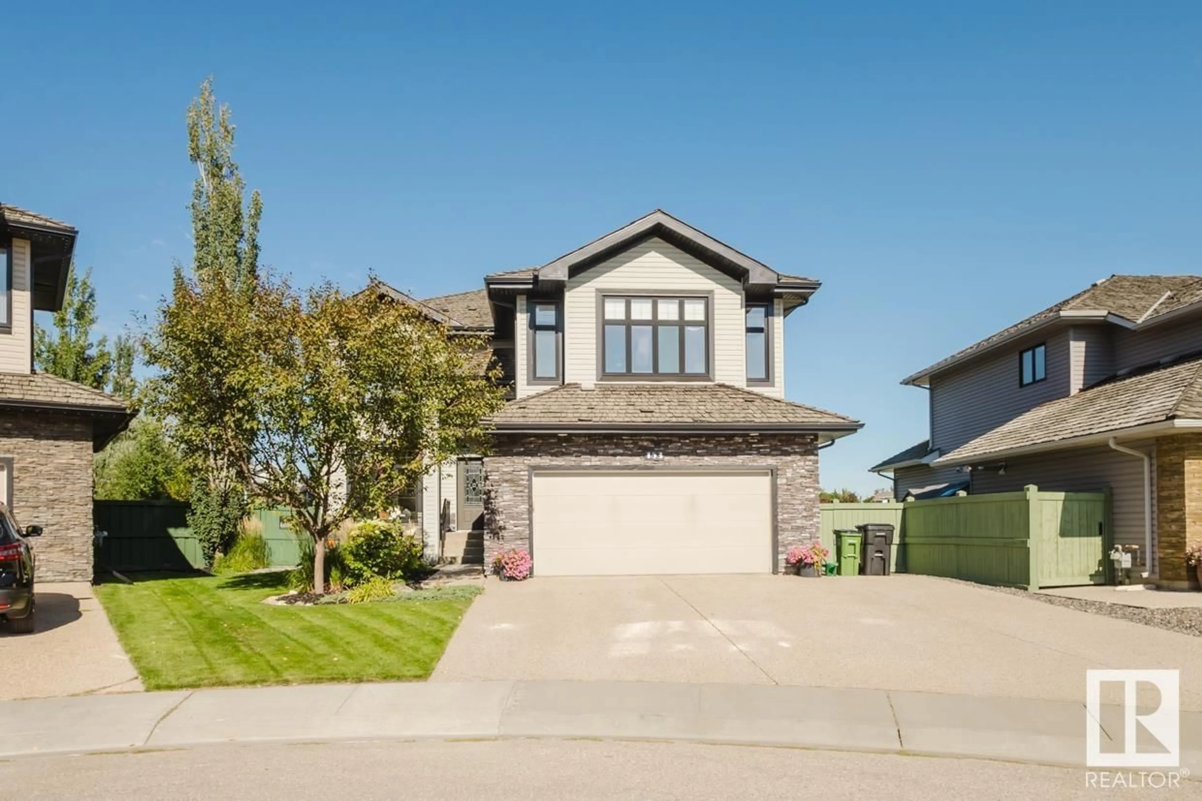 Frontside or backside of a home, the street view for 153 WEBER CL NW, Edmonton Alberta T6M0L4