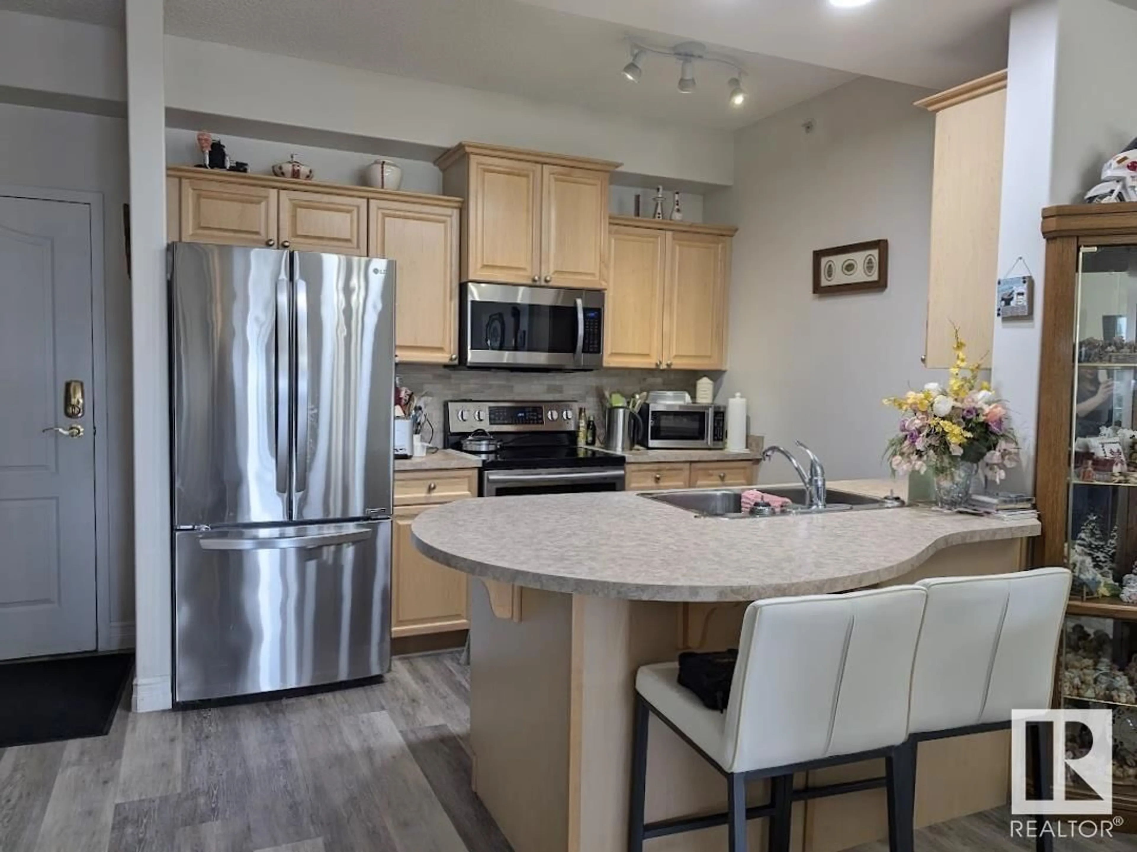 Open concept kitchen for #404 14259 50 ST NW, Edmonton Alberta T5A5J2