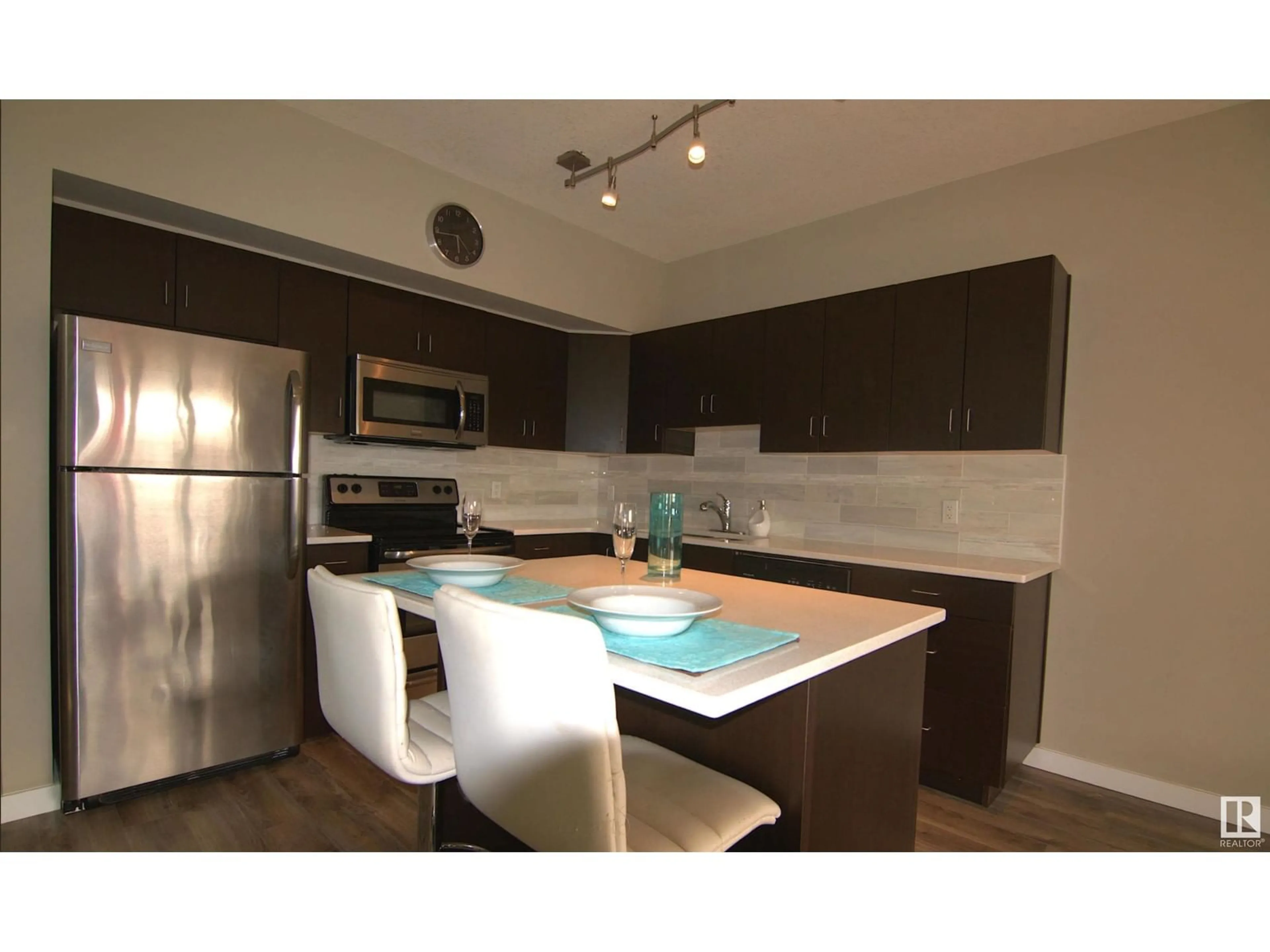 Open concept kitchen for #108 10518 113 ST NW, Edmonton Alberta T5H0C6