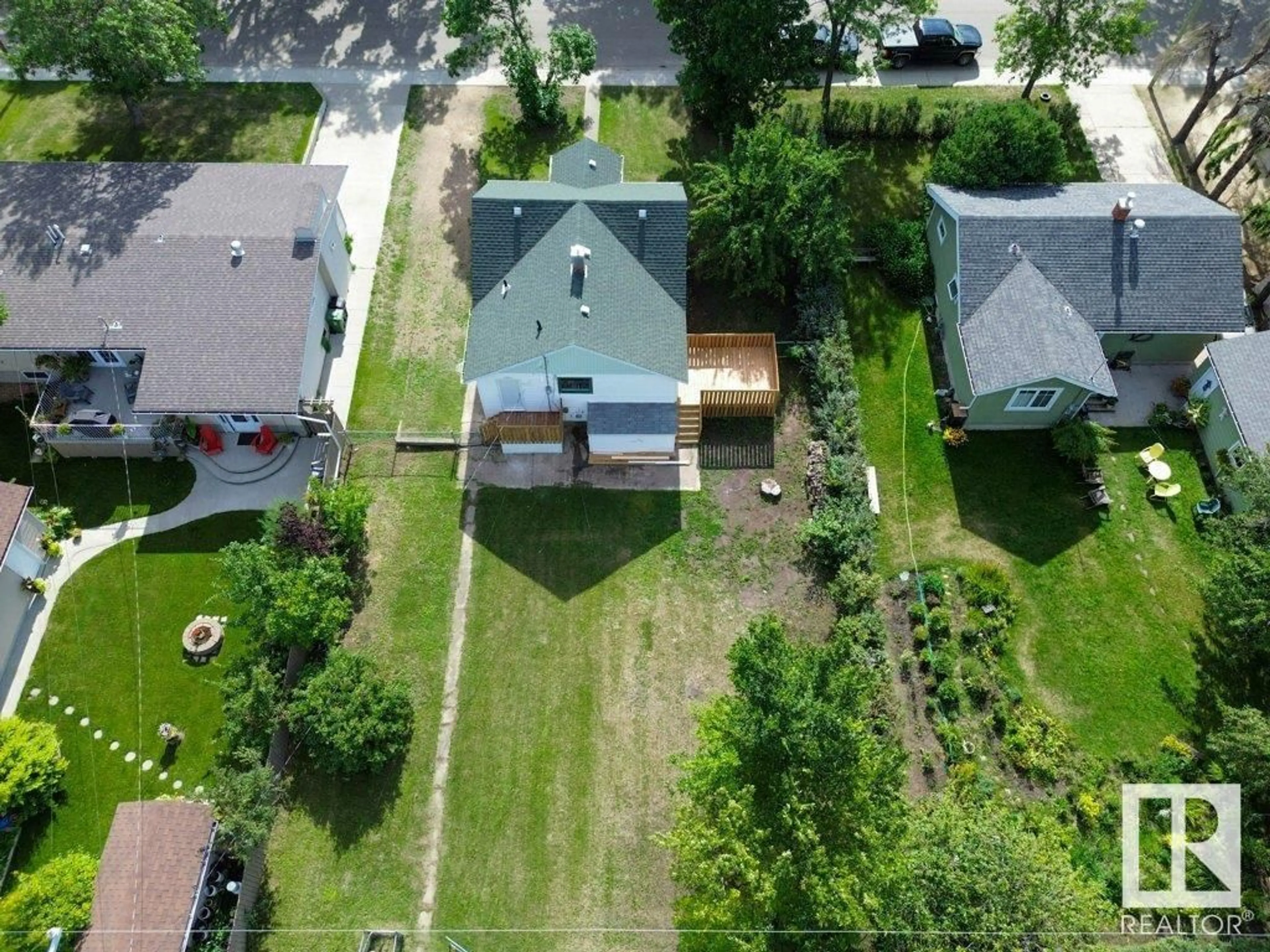 Frontside or backside of a home, the fenced backyard for 10020 105 ST, Westlock Alberta T7P1V2