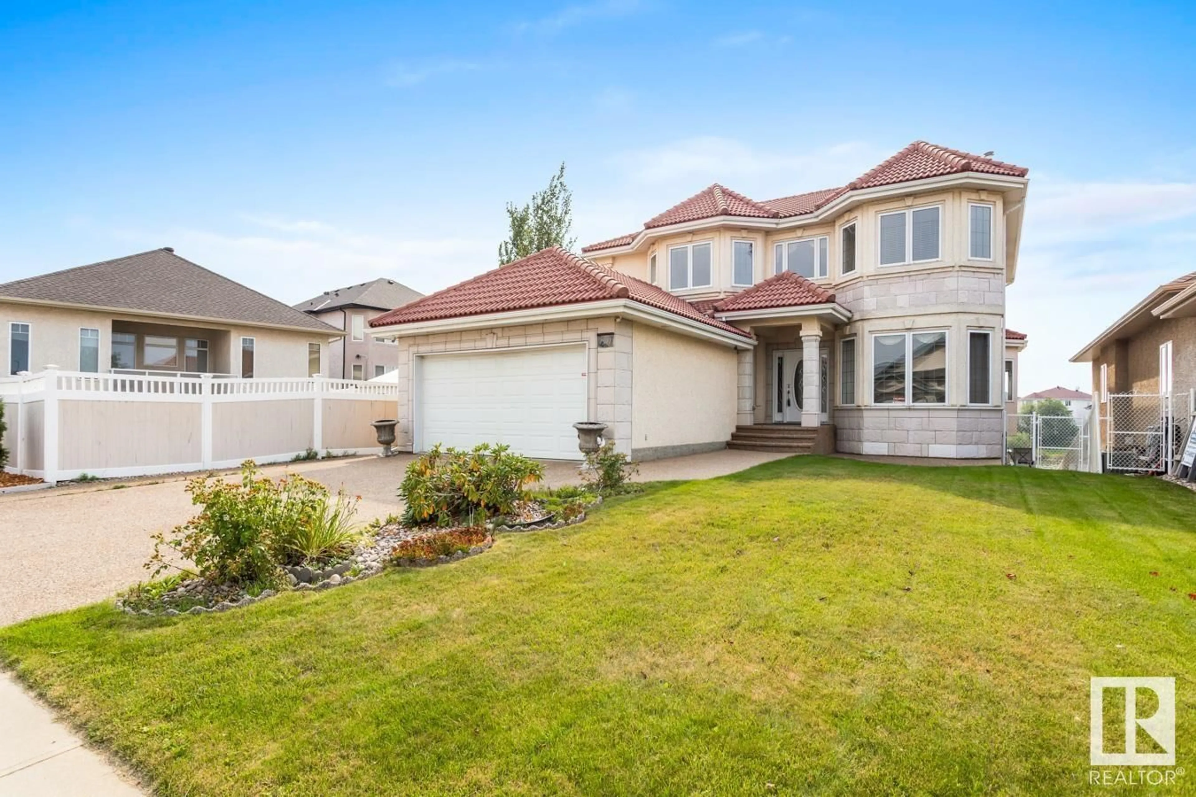 Frontside or backside of a home, the fenced backyard for 7507 162 AV NW, Edmonton Alberta T5Z3S7