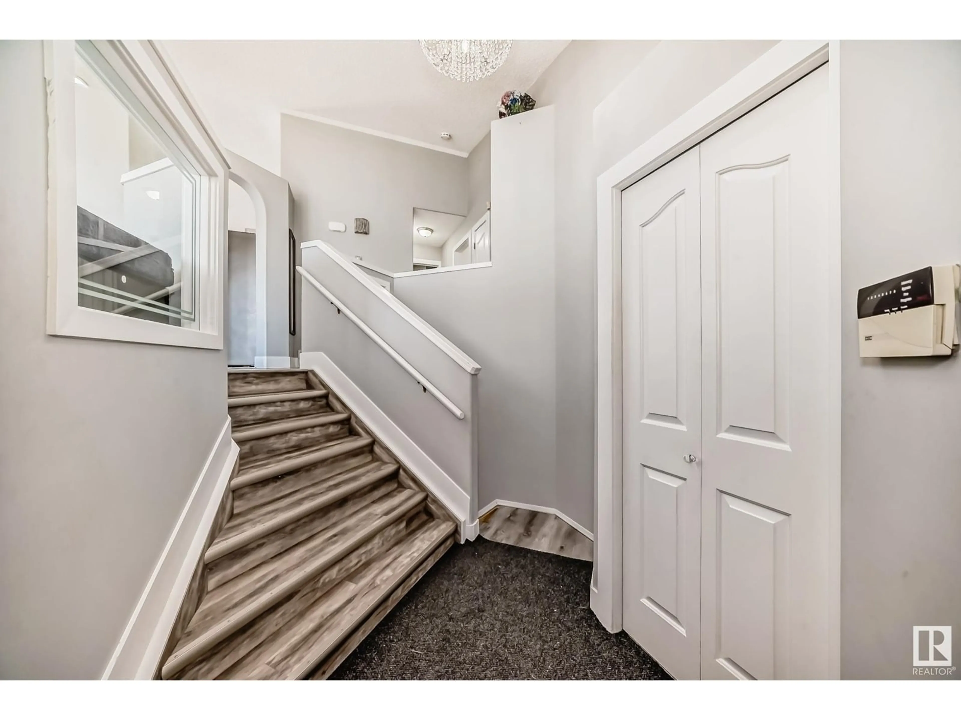 Indoor entryway, carpet floors for 2932 41 AV NW, Edmonton Alberta T6T1K5