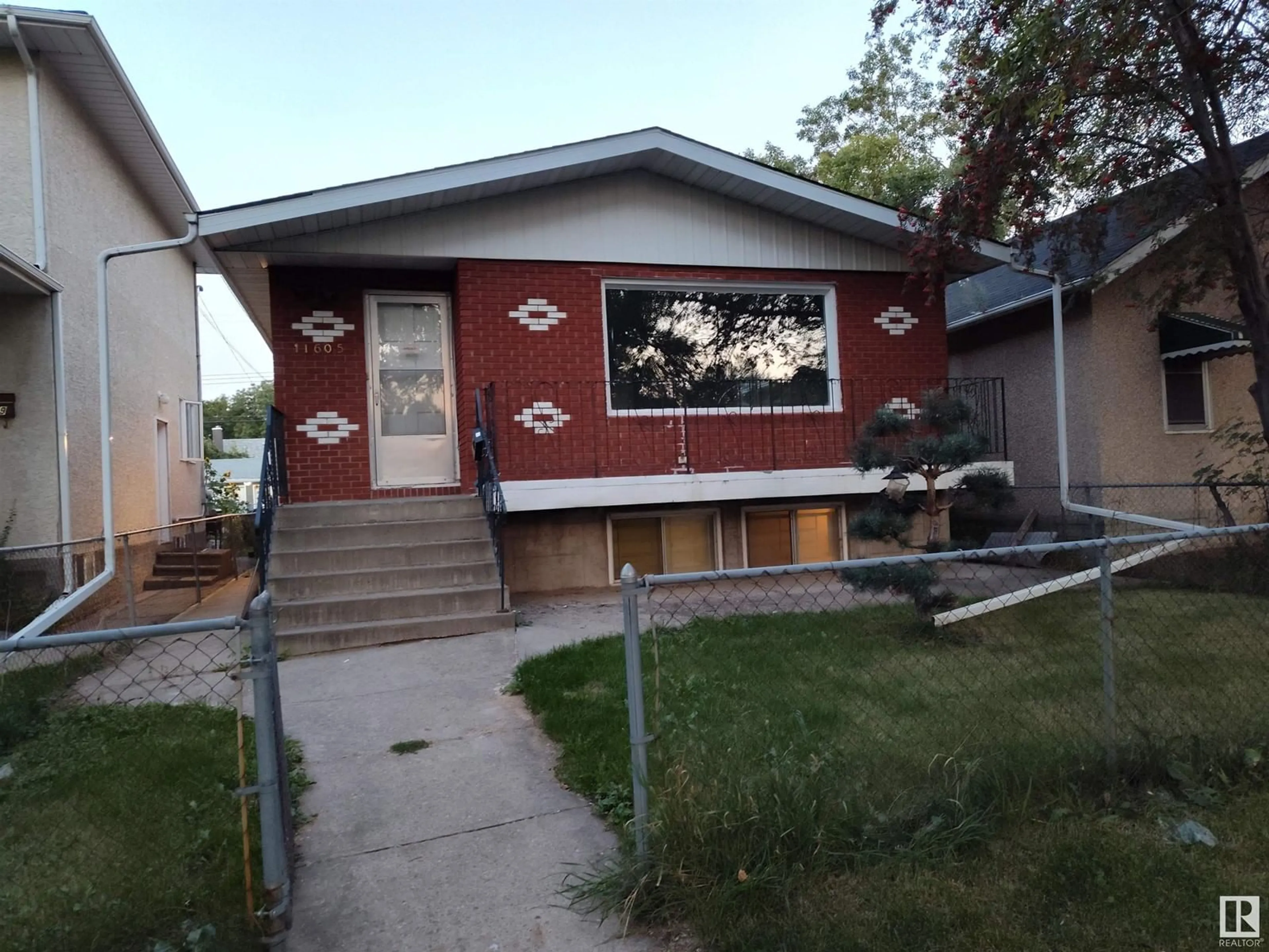 Frontside or backside of a home, the street view for 11605 93 ST NW, Edmonton Alberta T5G1C8