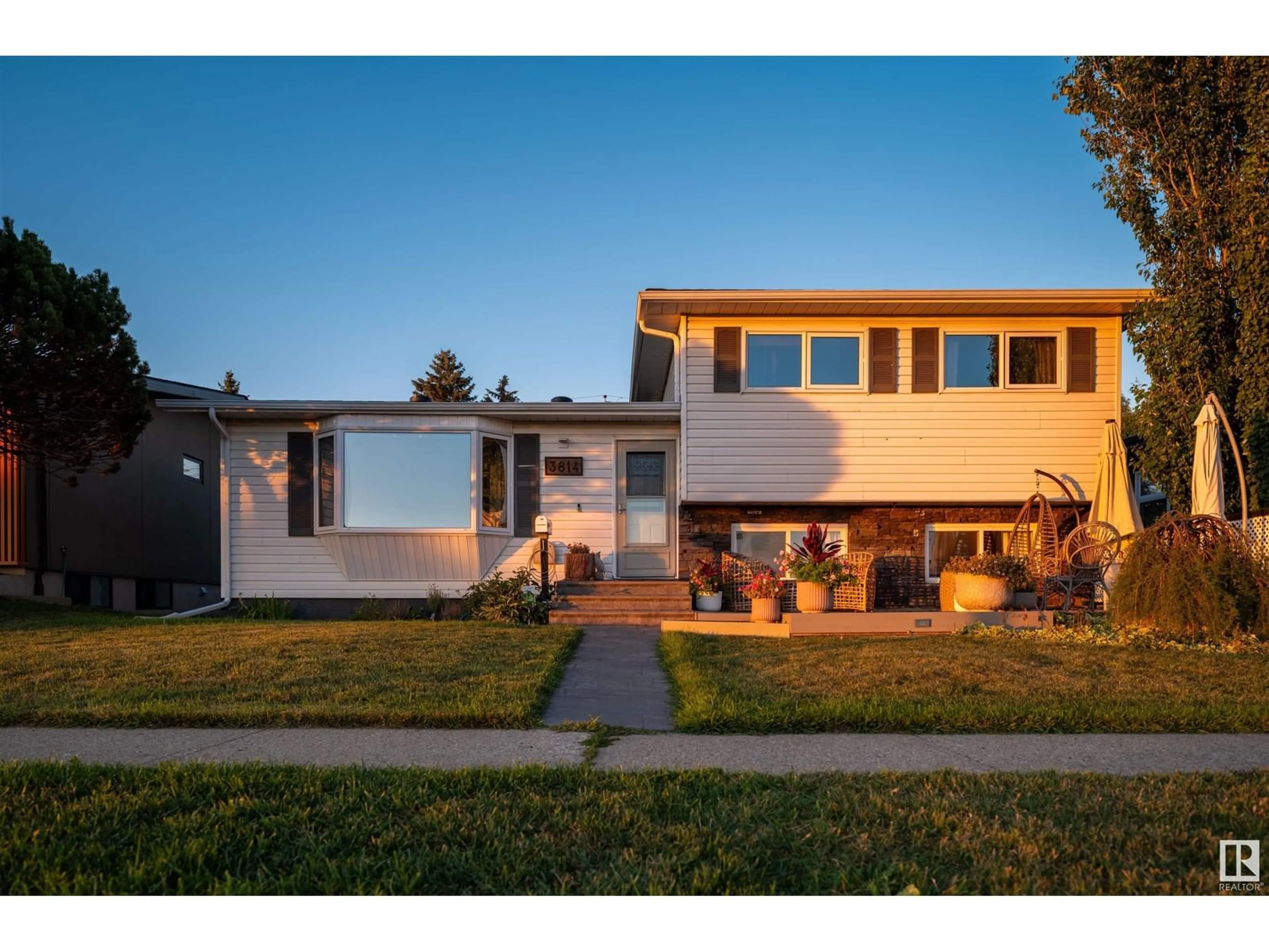 Frontside or backside of a home, the fenced backyard for 3814 ADA BV NW, Edmonton Alberta T5W4M4