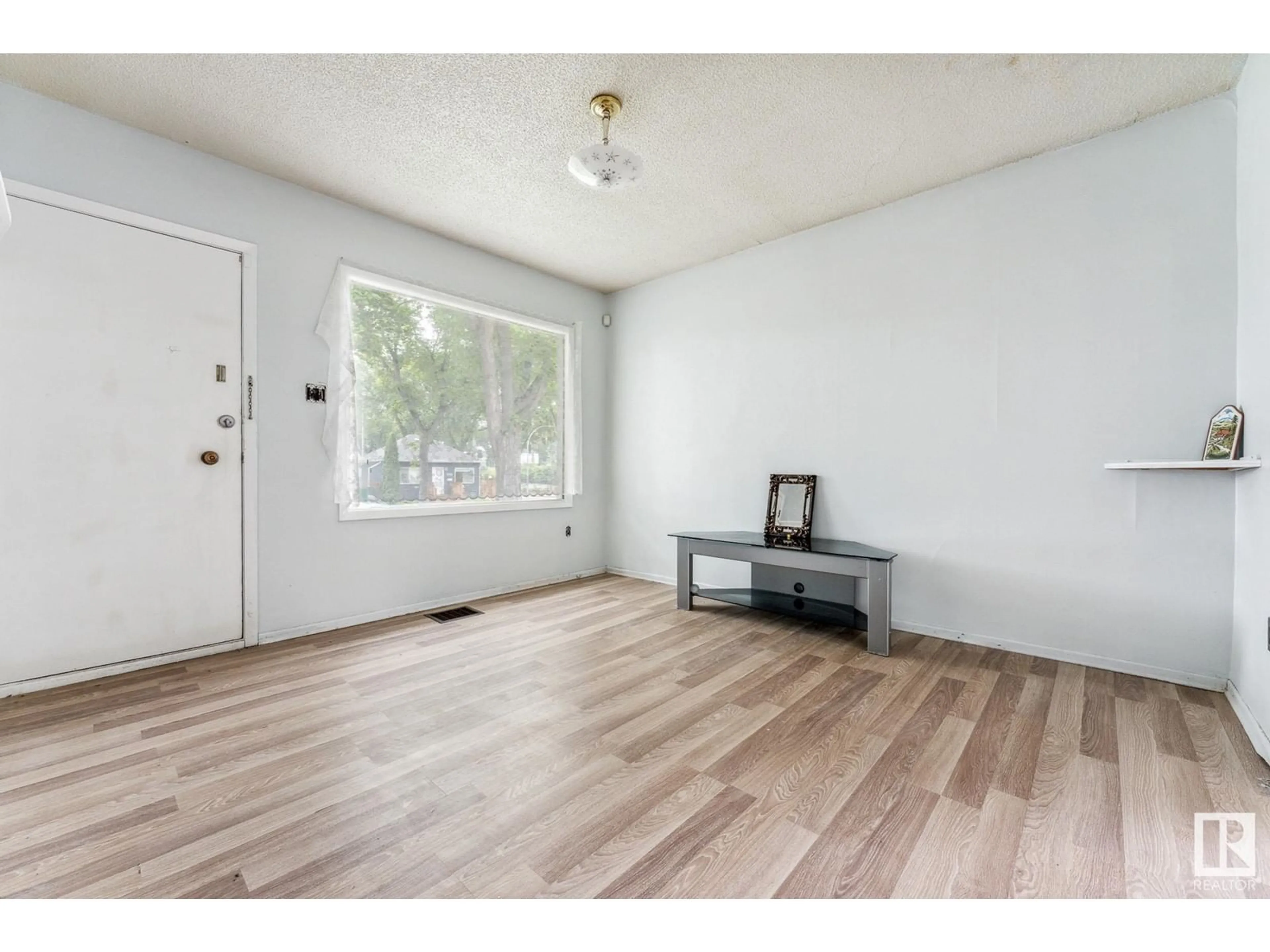 Indoor entryway, wood floors for 12008 65 ST NW, Edmonton Alberta T5W4L7