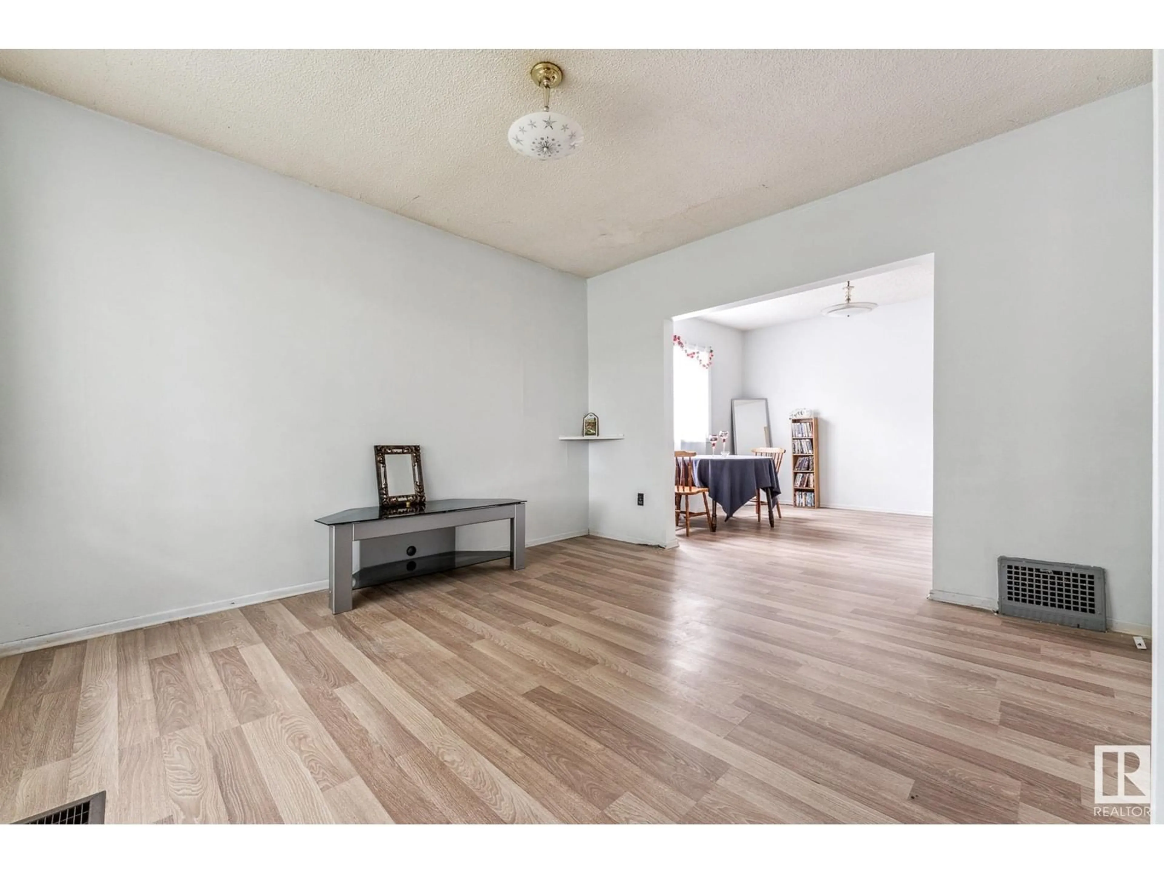 A pic of a room, wood floors for 12008 65 ST NW, Edmonton Alberta T5W4L7