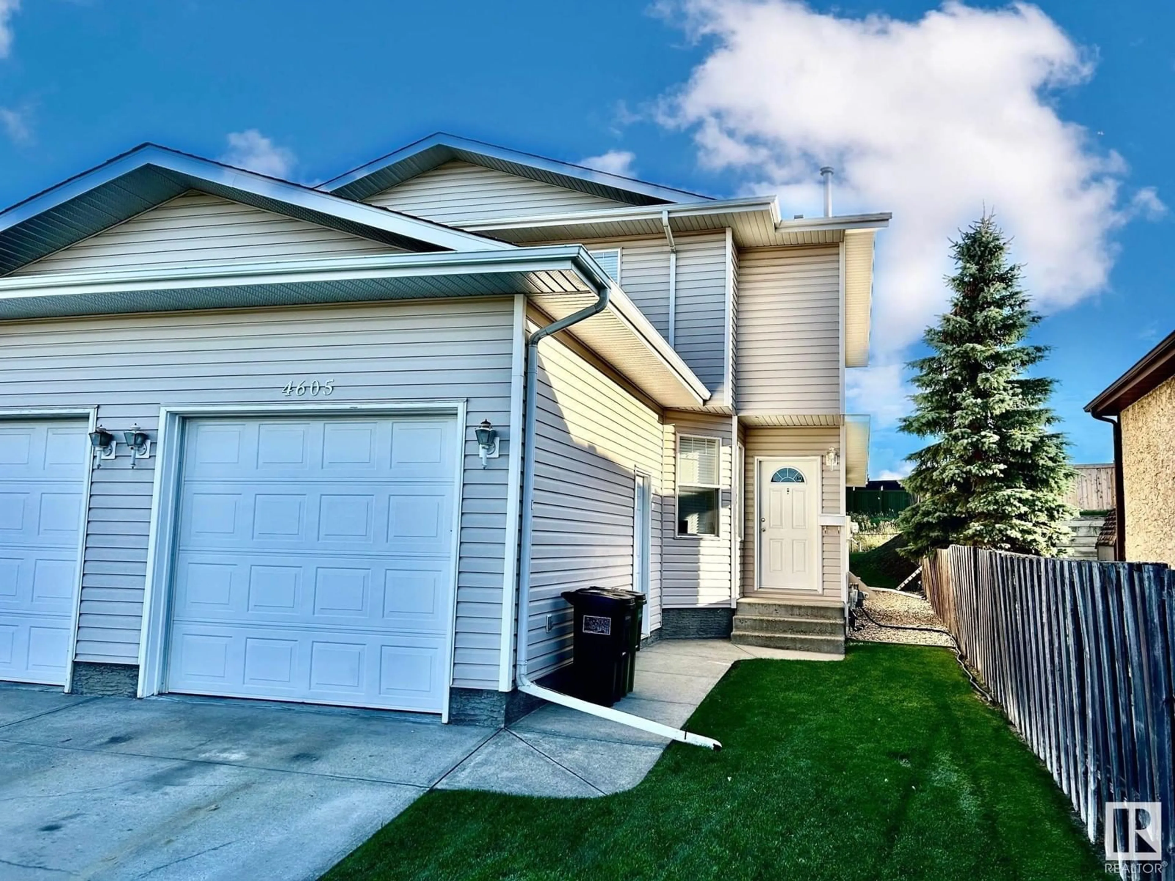 A pic from exterior of the house or condo, the fenced backyard for 4605 126 AV NW, Edmonton Alberta T5A4L1