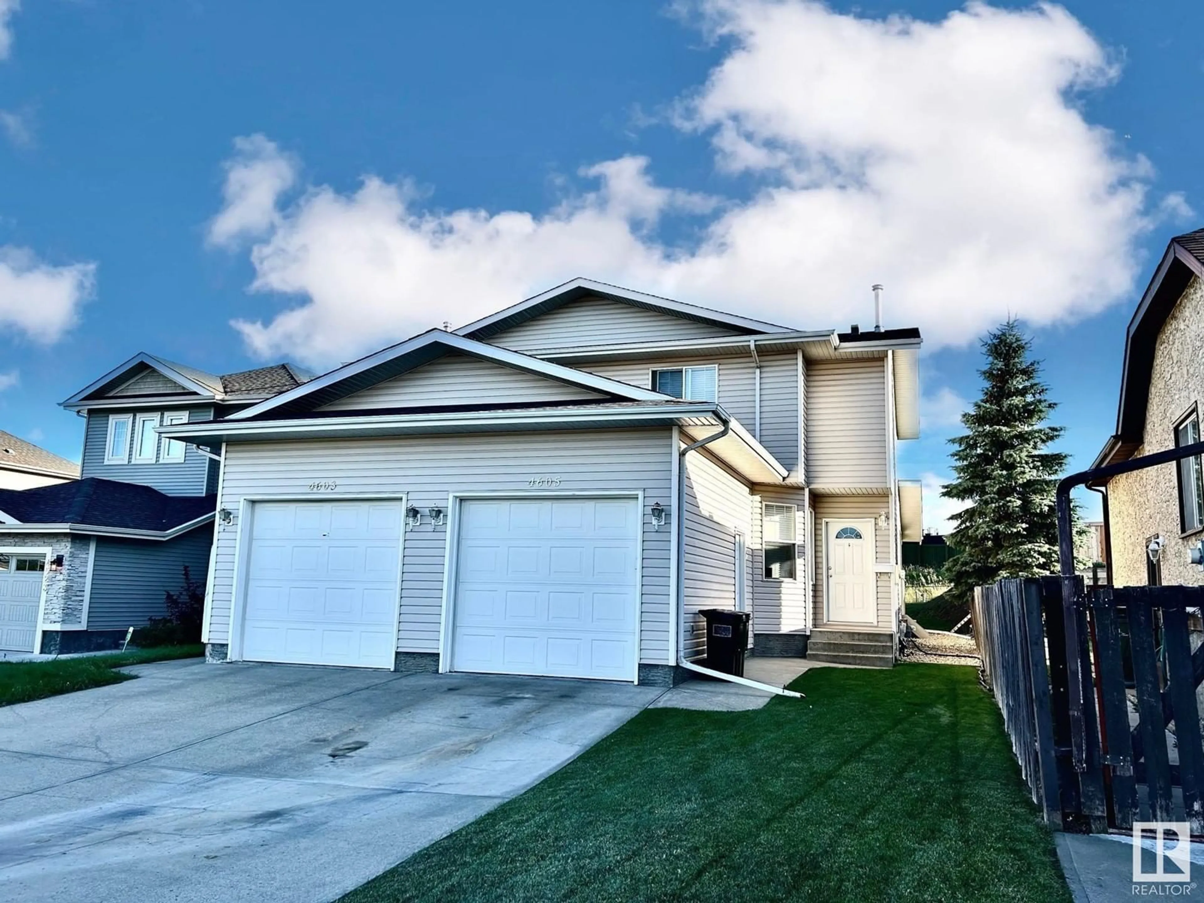 Frontside or backside of a home, the fenced backyard for 4605 126 AV NW, Edmonton Alberta T5A4L1