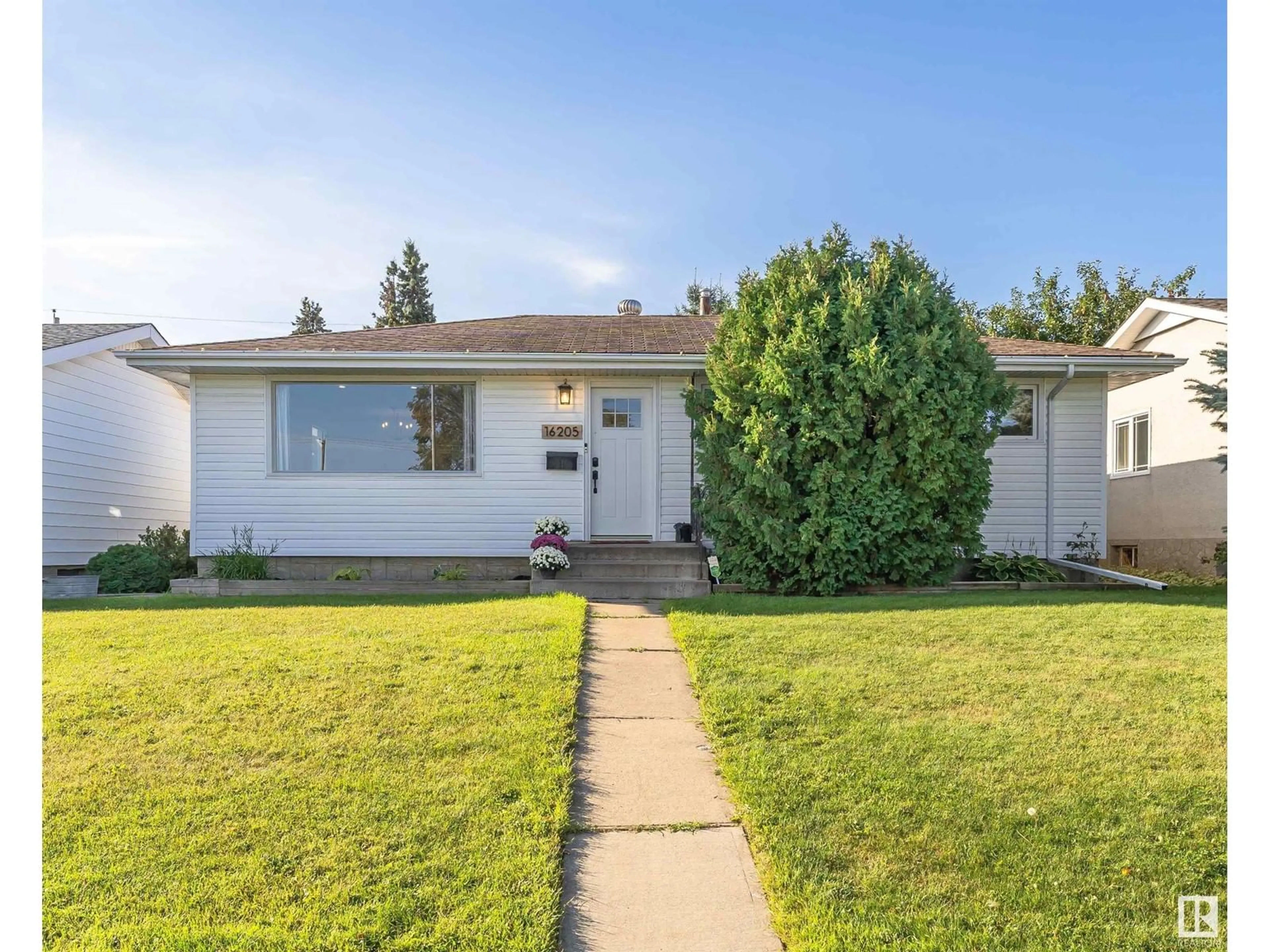 Frontside or backside of a home for 16205 86 AV NW, Edmonton Alberta T5R4C6