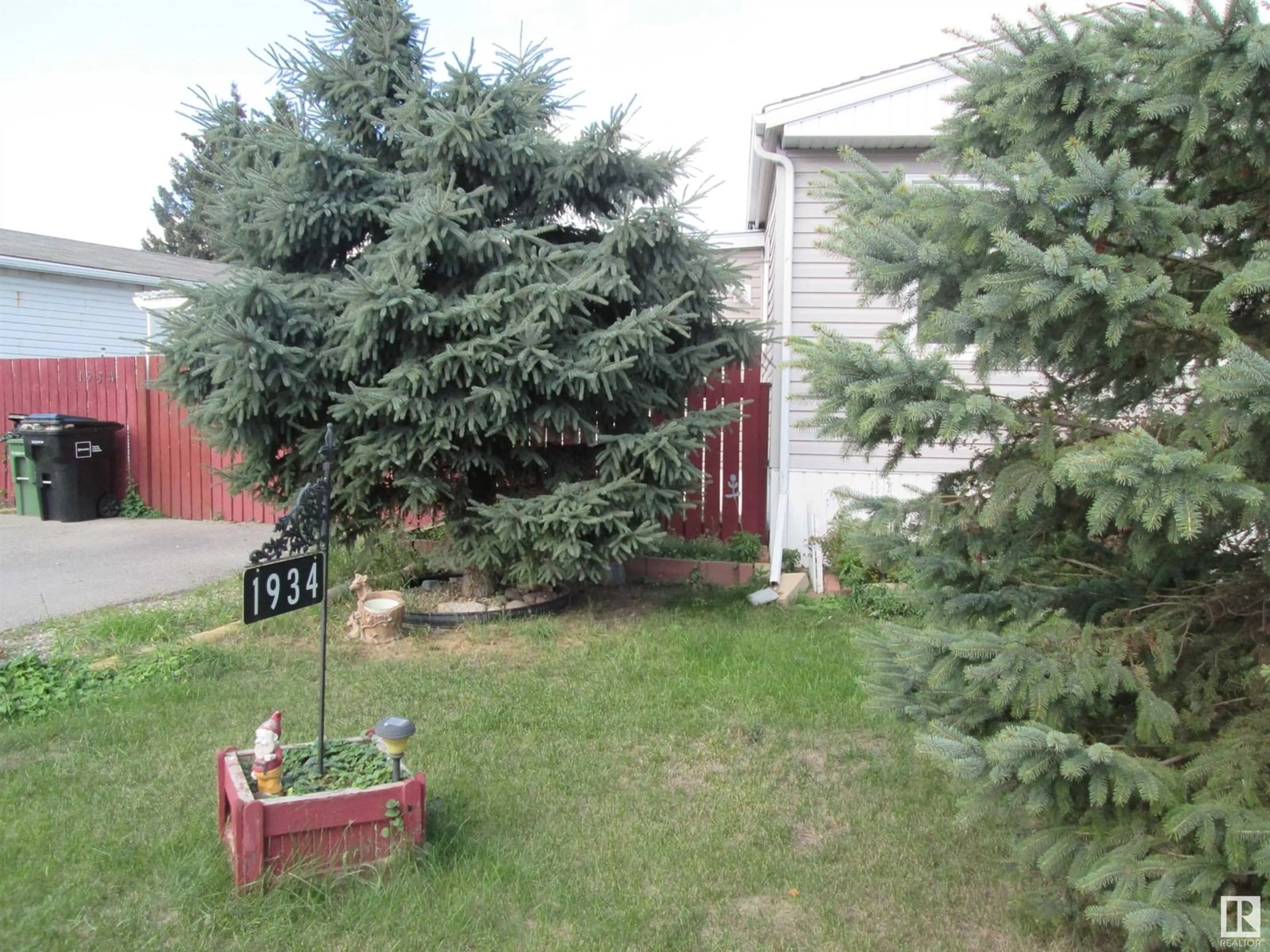 A pic from exterior of the house or condo, the fenced backyard for 1934 West Royal WY NW NW, Edmonton Alberta T5S1T6