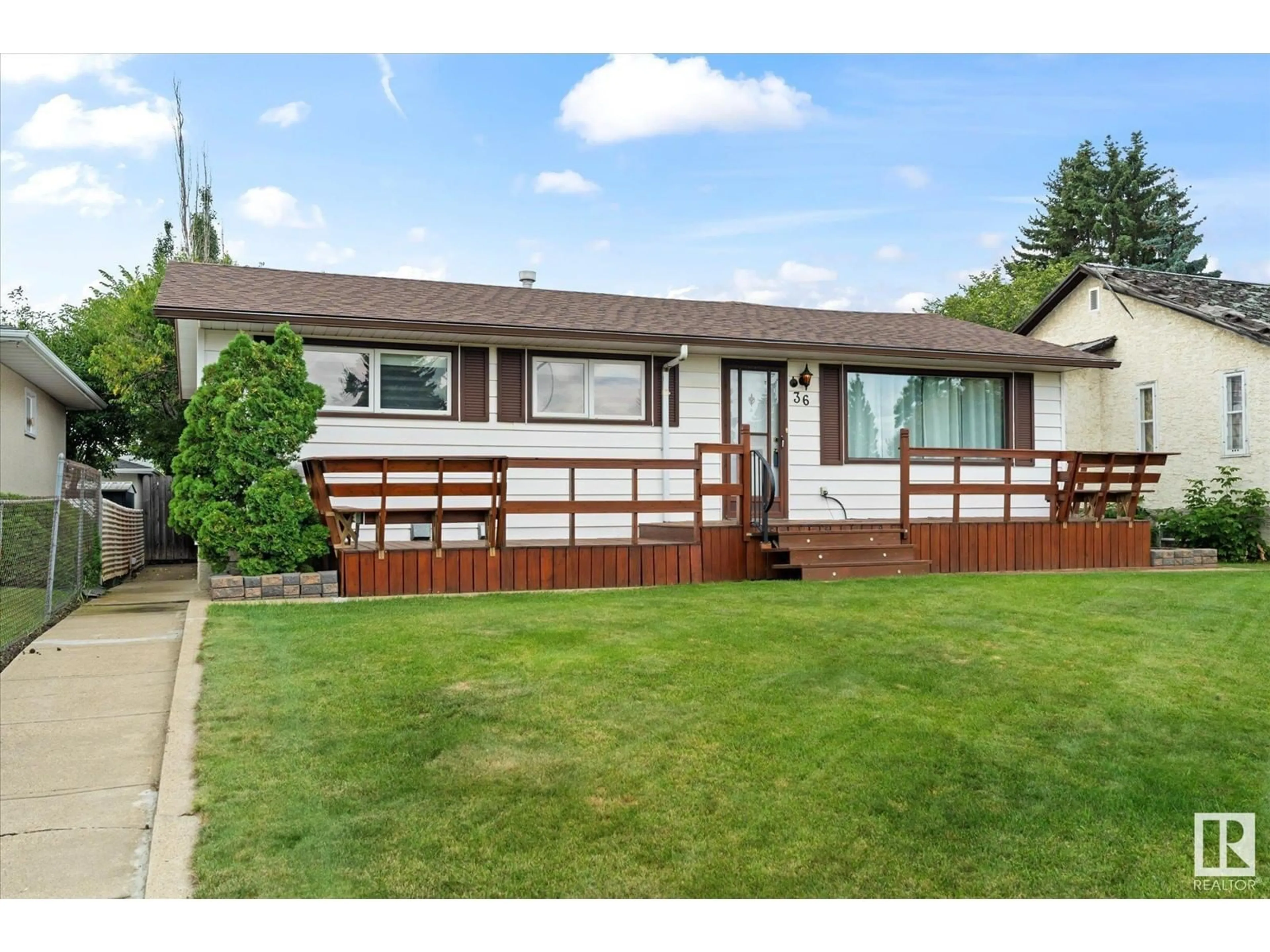 Frontside or backside of a home, the fenced backyard for 13436 115 ST NW NW, Edmonton Alberta T5E5G8