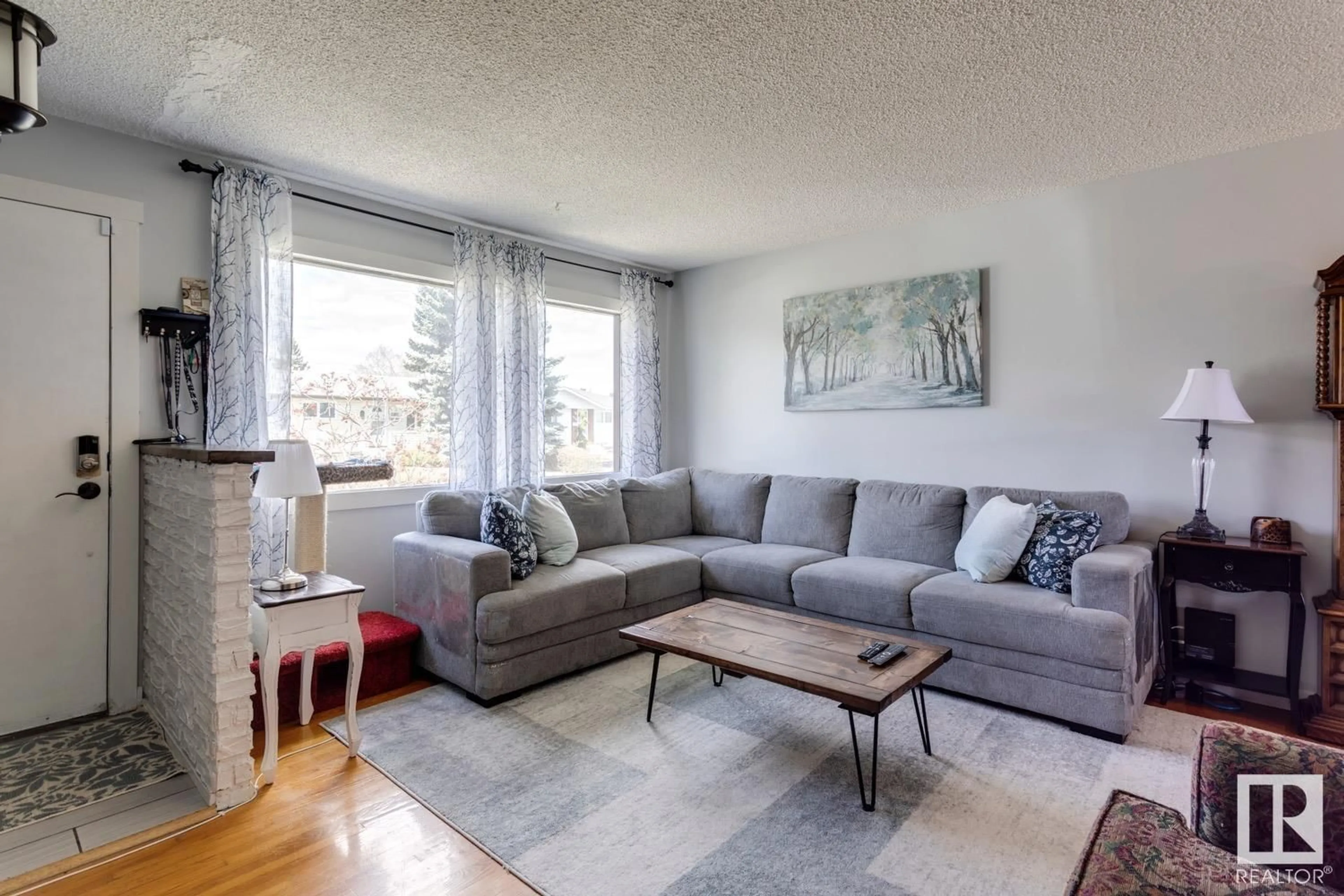 Living room, wood floors for 4711 105A ST NW, Edmonton Alberta T6H2P2