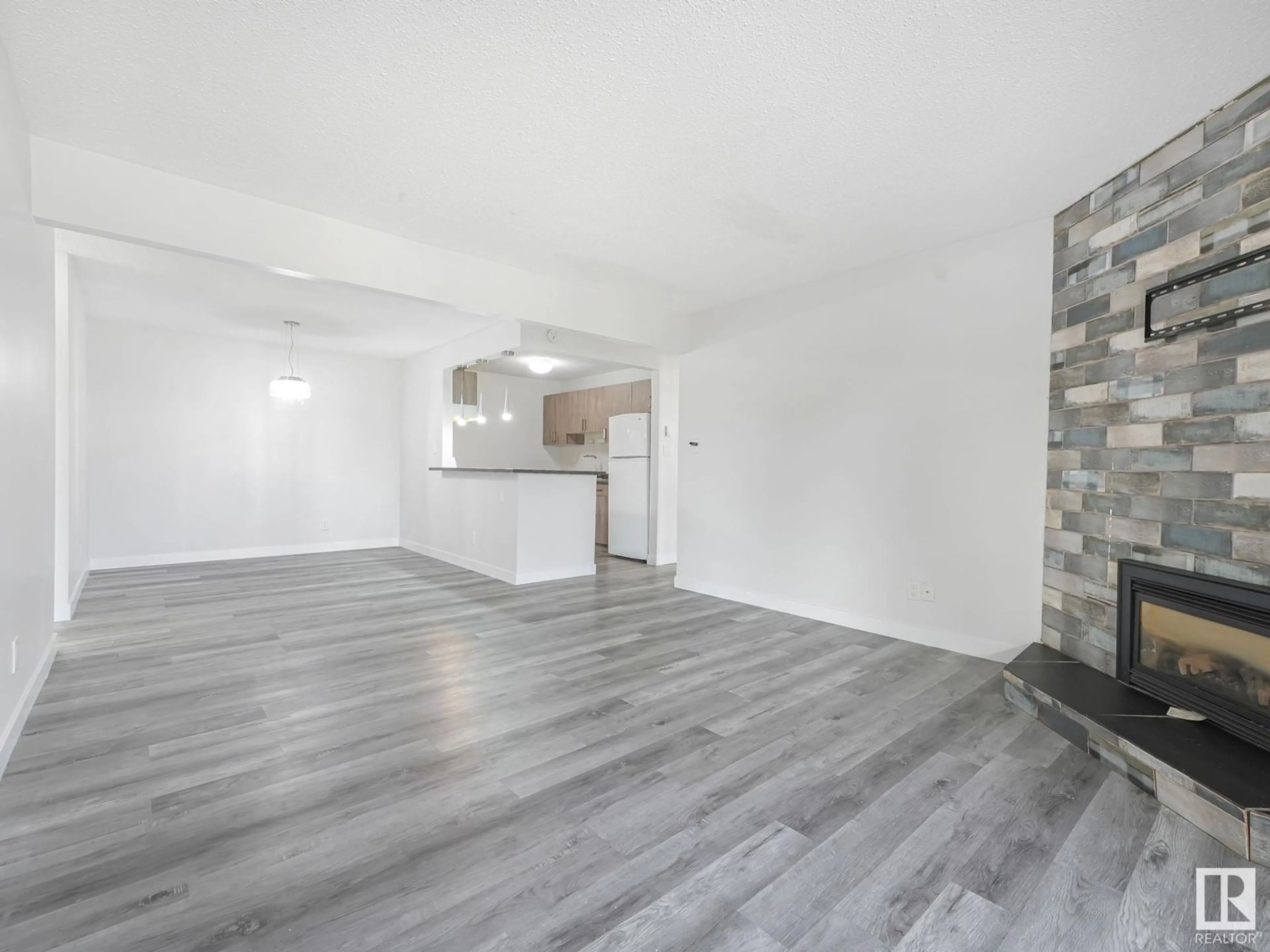 A pic of a room, wood floors for #303 10528 29 AV NW, Edmonton Alberta T6J4J2