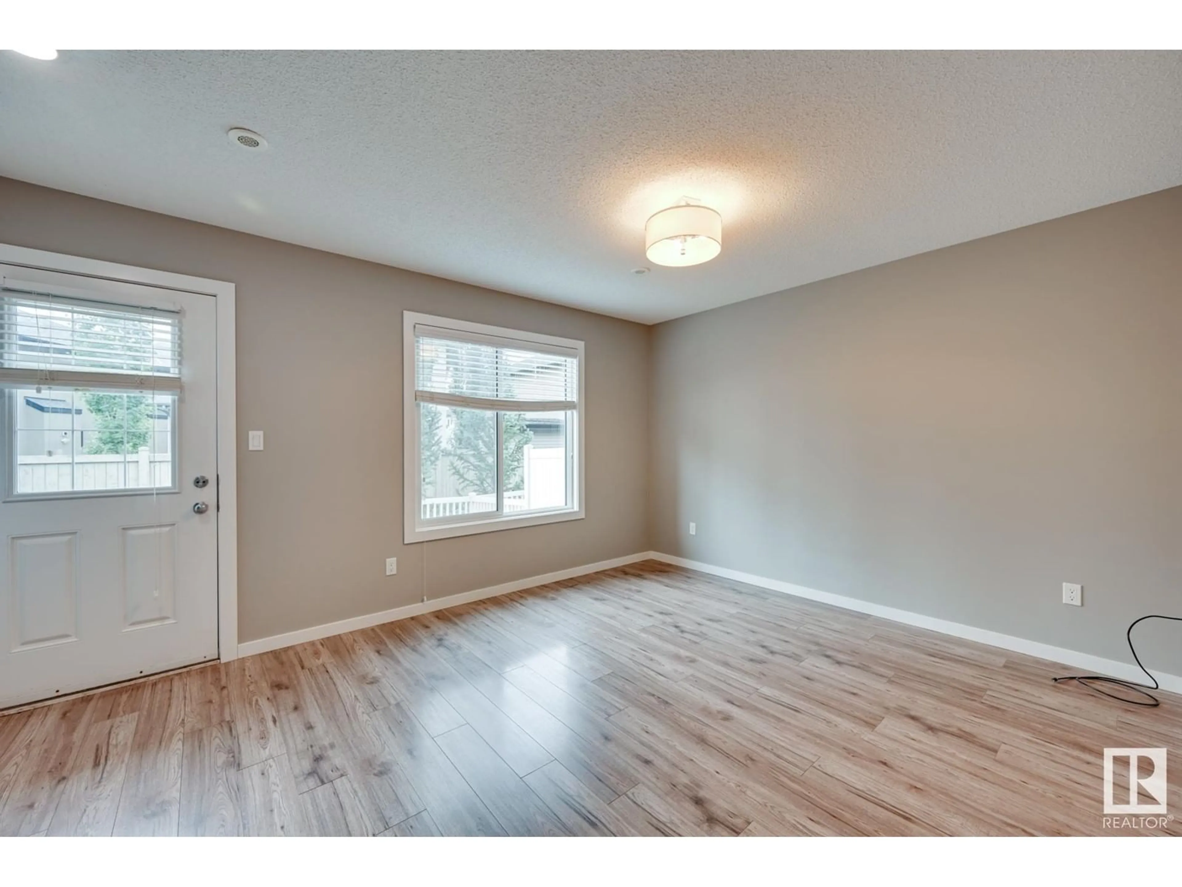 A pic of a room, wood floors for #29 2215 24 ST NW, Edmonton Alberta T6T1A6